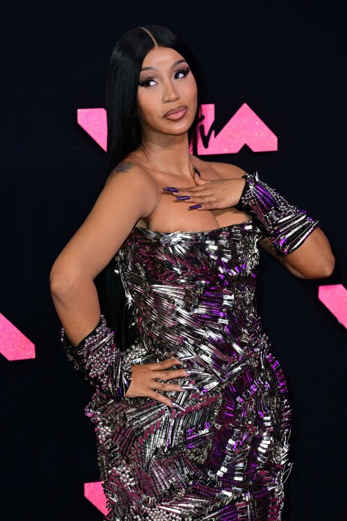 Cardi B | 2023 MTV Video Music Awards in Newark, New Jersey - September 12, 2023

Cardi B’s Metallic VMAs Gown Is Actually Made Up of Hundreds of Silver Hair Clips

Here’s to never having to worry about losing your bobby pin!

Cardi B—unsurprisingly—turned heads with her bold red-carpet ensemble for the 2023 MTV Video Music Awards.

The rapper showed up to New Jersey’s Prudential Center wearing a form-fitting strapless gown that, at first glance, appeared to be made up of glimmering metal shards. However, upon closer inspection, it turned out Cardi’s armorlike Dilara Findikoglu dress was actually covered in hundreds of silver hair clips, stacked and arranged in swirling and fanning patterns. She continued the theme with a pair of black arm cuffs, also studded with hair clips, and further accessorized with glittery heels and a metallic manicure.

Cardi has one nomination for tonight’s awards, in the category of Best Hip-Hop, for her collaboration with GloRilla on “Tomorrow 2.” She’ll also be among the ceremony’s performers, taking the stage with Megan Thee Stallion for their debut performance of “Bongos,” which just dropped on September 8. The duo last collaborated together on the viral “WAP,” back in 2020.

Cardi spoke about the new collab during a guest appearance on the Whoo’s House podcast.

“I wonder how people are gonna react to this vibe because they’re really like expecting ‘WAP,’ like, ‘Oh, here they go again talking this and that,'” Cardi said to host DJ Whoo Kid, per Billboard. “We are talking a little, you know, about some p—y, but not like ‘WAP’ type of stuff.”

Of the forthcoming “Bongos” music video, she added: “It’s a different theme and the video is like a whole complete different type of theme. … It’s like on some ‘b—h, you jump, I jump … if you wit it, I I wit it. We’re gonna do it.’ We worked so hard on the music video. You’re gonna see … that’s thought put into that.”

Other expected performers for tonight’s show include Demi Lovato, Shakira, Doja Cat, Anitta, Olivia Rodrigo, and Sabrina Carpenter.

harpersbazaar.com

#CardiB #vmas