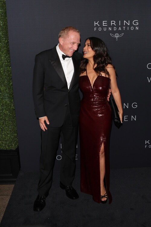 Salma Hayek - Kering Hosts 2nd Annual Caring for Women in New York - September 12, 2023

Salma Hayek oozes glamour in a plunging sequinned burgundy gown as she attends the Caring For Women charity dinner

Salma Hayek was sure to turn heads as she put on a very glamorous display at the Kering Foundation's second annual Caring For Women Dinner in New York on Tuesday, held to raise money for domestic abuse survivors.

The actress, 57, dazzled in a plunging sequinned burgundy gown as she graced the black carpet at the charity gala held to raise money for domestic abuse survivors.

Salma was sure to look her best for the star-studded event, as she posed this way and that in the figure-hugging dress which featured a split at the leg.

The Frida star accessorised her glam look with black heels and a coordinating clutch bag, finishing things off with silver drop earrings.

Salma was in good company as she posed alongside longtime husband and Kering CEO François-Henri Pinault, 61, who looked dapper in a black suit.

Pinault is chairman of the Kering Foundation and his wife Hayek is on the board of directors.

The second annual Caring For Women dinner is presented by the Kering Foundation — the leading foundation combatting the epidemic that is violence against women and girls.

It is a celebration of the charitable organization's 15th anniversary and the theme of the evening was 'strength in numbers,' as per WWD.

Hayek and Pinault co-chaired the event with the likes of supermodel Christy Turlington, Olivia Wilde and Zoe Kravitz among others.

This year's star-studded dinner benefitted organizations that 'address gender-based violence.'

'Despite alarming setbacks in women's rights around the world, there has been heartening progress to address violence against women in the last 15 years, and we must continue to harness the power of collaboration and solidarity to ensure that all women can lead fulfilling lives free from violence,' Pinault said in a statement head of Tuesday's soiree.

Salma's outing comes days after she proved age is just a number while showcasing her age-defying figure in a black and white patterned bikini.

In her latest Instagram post, the 57-year-old Oscar nominee looked nothing short of sensational in a flowy light blue cover-up as she cruised around on the ocean on a yacht.

As she posed, with windswept hair and a coy smile, the House of Gucci star placed one hand on her right hip and gave the camera her best smoldering stare.

'What’s wrong with Sunday blues?' she captioned the photo, which received more than 351,695 likes in just six hours.

Her latest post comes after gushing to fans that she is 'so happy to be alive and so profoundly grateful for all the blessings.'

'My beloved family, my precious friends, my health, my work that keeps me going, my empowering team, my relationship with animals & nature, and the love of all my loyal fans,' she captioned a sexy slideshow of snaps of her at the beach.

She concluded: 'Happy 57th birthday to me!!!'

DailyMail

#SalmaHayek