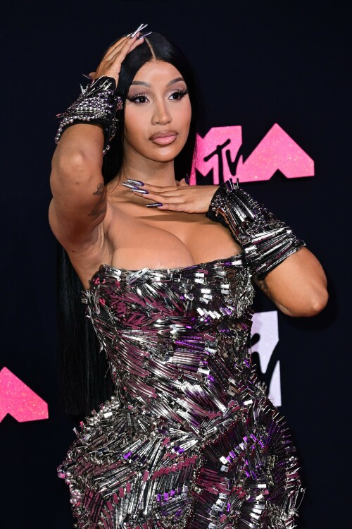 Cardi B | 2023 MTV Video Music Awards in Newark, New Jersey - September 12, 2023

Cardi B’s Metallic VMAs Gown Is Actually Made Up of Hundreds of Silver Hair Clips

Here’s to never having to worry about losing your bobby pin!

Cardi B—unsurprisingly—turned heads with her bold red-carpet ensemble for the 2023 MTV Video Music Awards.

The rapper showed up to New Jersey’s Prudential Center wearing a form-fitting strapless gown that, at first glance, appeared to be made up of glimmering metal shards. However, upon closer inspection, it turned out Cardi’s armorlike Dilara Findikoglu dress was actually covered in hundreds of silver hair clips, stacked and arranged in swirling and fanning patterns. She continued the theme with a pair of black arm cuffs, also studded with hair clips, and further accessorized with glittery heels and a metallic manicure.

Cardi has one nomination for tonight’s awards, in the category of Best Hip-Hop, for her collaboration with GloRilla on “Tomorrow 2.” She’ll also be among the ceremony’s performers, taking the stage with Megan Thee Stallion for their debut performance of “Bongos,” which just dropped on September 8. The duo last collaborated together on the viral “WAP,” back in 2020.

Cardi spoke about the new collab during a guest appearance on the Whoo’s House podcast.

“I wonder how people are gonna react to this vibe because they’re really like expecting ‘WAP,’ like, ‘Oh, here they go again talking this and that,'” Cardi said to host DJ Whoo Kid, per Billboard. “We are talking a little, you know, about some p—y, but not like ‘WAP’ type of stuff.”

Of the forthcoming “Bongos” music video, she added: “It’s a different theme and the video is like a whole complete different type of theme. … It’s like on some ‘b—h, you jump, I jump … if you wit it, I I wit it. We’re gonna do it.’ We worked so hard on the music video. You’re gonna see … that’s thought put into that.”

Other expected performers for tonight’s show include Demi Lovato, Shakira, Doja Cat, Anitta, Olivia Rodrigo, and Sabrina Carpenter.

harpersbazaar.com

#CardiB #vmas