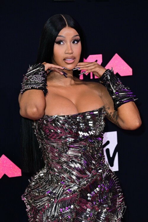 Cardi B | 2023 MTV Video Music Awards in Newark, New Jersey - September 12, 2023

Cardi B’s Metallic VMAs Gown Is Actually Made Up of Hundreds of Silver Hair Clips

Here’s to never having to worry about losing your bobby pin!

Cardi B—unsurprisingly—turned heads with her bold red-carpet ensemble for the 2023 MTV Video Music Awards.

The rapper showed up to New Jersey’s Prudential Center wearing a form-fitting strapless gown that, at first glance, appeared to be made up of glimmering metal shards. However, upon closer inspection, it turned out Cardi’s armorlike Dilara Findikoglu dress was actually covered in hundreds of silver hair clips, stacked and arranged in swirling and fanning patterns. She continued the theme with a pair of black arm cuffs, also studded with hair clips, and further accessorized with glittery heels and a metallic manicure.

Cardi has one nomination for tonight’s awards, in the category of Best Hip-Hop, for her collaboration with GloRilla on “Tomorrow 2.” She’ll also be among the ceremony’s performers, taking the stage with Megan Thee Stallion for their debut performance of “Bongos,” which just dropped on September 8. The duo last collaborated together on the viral “WAP,” back in 2020.

Cardi spoke about the new collab during a guest appearance on the Whoo’s House podcast.

“I wonder how people are gonna react to this vibe because they’re really like expecting ‘WAP,’ like, ‘Oh, here they go again talking this and that,'” Cardi said to host DJ Whoo Kid, per Billboard. “We are talking a little, you know, about some p—y, but not like ‘WAP’ type of stuff.”

Of the forthcoming “Bongos” music video, she added: “It’s a different theme and the video is like a whole complete different type of theme. … It’s like on some ‘b—h, you jump, I jump … if you wit it, I I wit it. We’re gonna do it.’ We worked so hard on the music video. You’re gonna see … that’s thought put into that.”

Other expected performers for tonight’s show include Demi Lovato, Shakira, Doja Cat, Anitta, Olivia Rodrigo, and Sabrina Carpenter.

harpersbazaar.com

#CardiB #vmas