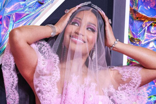 Nicki Minaj | 2023 MTV Video Music Awards in Newark, New Jersey - September 12, 2023

Nicki Minaj Is a Bridal Barbie at the 2023 MTV VMAs

She channeled romance while returning to host this year’s show

Nicki Minaj returned to her Barbiecore roots at the 2023 MTV Video Music Awards.

The rapper—who dubbed herself “Barbie” long before the doll took over the globe this year—made a grand appearance on this year’s red carpet at the Prudential Center in Newark, New Jersey. The star put her own romantic spin on lingerie dressing in a pale pink gown by Dolce & Gabbana, which featured a strapless satin bodysuit and a sheer lace mermaid skirt that fanned out into a circular train. A matching see-through veil with lace trim completed the look.

The rapper finished the monochromatic ensemble with floral-shaped earrings, a diamond tennis bracelet, and an array of diamond rings. Her opulent glam look included a sparkling eye look with pink shadow and sharp cat-eye liner, as well as a nude lip and extra-long bejeweled pink nails.

Minaj is up for six awards tonight, including Artist of the Year and Video of the Year. The host is also set to take the stage twice to perform, both as a solo act and as part of the night’s tribute to hip-hop’s 50th anniversary. For the latter, she will join Lil Wayne, Darryl “DMC” McDaniels, Doug E. Fresh, Grandmaster Flash and the Furious Five, and LL Cool J.

At last year’s awards, Minaj received the Video Vanguard Award and treated the audience to a mash-up performance of hits including “Monster,” “Moment 4 Life,” and “Anaconda.” She transformed the VMAs stage into a Barbie DreamHouse in a tribute to her fans, the Barbz, complete with a matching Barbiecore look composed of a bedazzled corset with crystal-covered sleeves, a flared light-pink skirt, and black platform boots with hot-pink laces.

harpersbazaar

#NickiMinaj #vmas