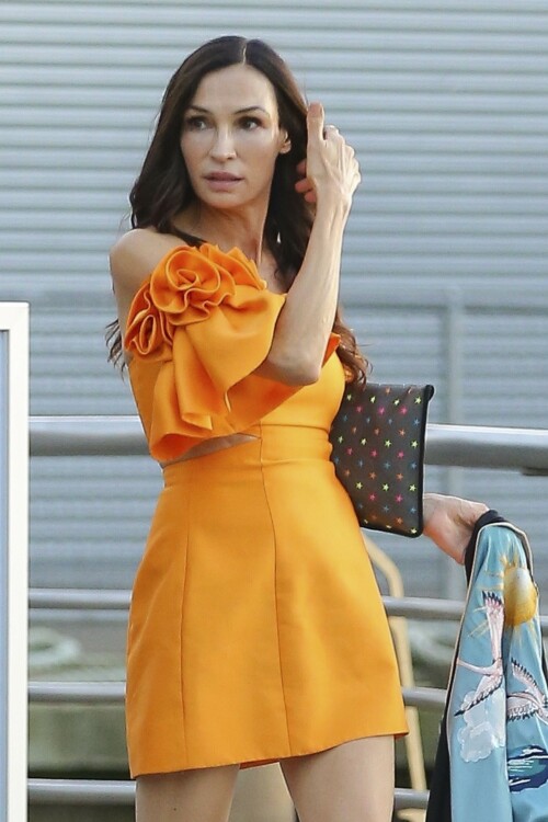 Famke Janssen | Candids In Yellow Dress in New York - October 4, 2023