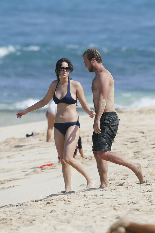 Jennifer Lawrence | On the beach in Hawaii - November 22, 2012

Jennifer Lawrence wearing Tory Burch Claire Bucket Bag, Burberry Be 4107 Sunglasses and Billabong Cloud Covera Skirt.

Jennifer Lawrence: Bikini After Thanksgiving in Hawaii

Jennifer Lawrence shows off her toned tummy in a navy bikini after Thanksgiving dinner with her brother Blaine on Thursday afternoon (November 22) in Maui, Hawaii.

The 22-year-old actress enjoyed a Thanksgiving meal with her whole family before hitting the sand, ahead of filming her upcoming movie, The Hunger Games: Catching Fire.

Just the day before, Jennifer was spotted with mom Karen for a laid-back stroll

And earlier in the week, Jennifer was in Los Angeles promoting her new film, Silver Linings Playbook.

JustJared

#JenniferLawrence