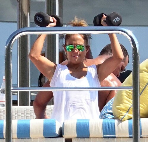 Jennifer Lopez | Workout on a yacht in Costiera Amalfitana Capri - August 7, 2018

SHIP SHAPE: Jennifer Lopez works out on the deck of a super-yacht on romantic holiday in Italy with boyfriend Alex Rodriguez

The singer/actress refused to let her holiday get in the way of her fitness regime as she cruised around the island of Capri with her man

JENNIFER Lopez looks ship shape working out on the deck of a super-yacht during a romantic holiday in Italy with her boyfriend Alex Rodriguez.

The singer/actress, 49, was pictured in a white bikini as she cruised around the island of Capri with her man.

Jennifer Lopez braved the heat by working out on the deck of a super-yacht

The couple chilled out on cushions as they soaked up the sun together on the luxury vessel during a trip down Italy's Amalfi Coast.

As well as taking in the lavish island of Capri, they also headed down to the town of Positano.

J-Lo was seen stretched out on the deck before leaning in to get close to her man.

However, the singer/actress can't sit about doing nothing for long and was later seen working out on deck despite the soaring temperatures.

Jennifer lifted weights as she kept up her gruelling fitness routine even though she's on holiday.

The couple's holiday comes just days after J-Lo sparked engagement rumours by flashing a huge diamond sparkler on her wedding ring finger.

The megastar celebrated her 49th birthday with baseball legend Alex, 42, in the Bahamas and wore the Cartier ring in holiday snaps shared on Instagram.

In one pic taken by her pal and photographer Ana Carballosa, J-Lo made no effort to hide the expensive silver ring and its unique intricate design made sure it was hard to miss.

Jen captioned her gallery of photos with a warm tribute to her family and fans - but didn't confirm if she's engaged.

She wrote: "So believe it or not I’m just waking up from my birthday celebration last night. It was a small gathering with the kids and some family and a couple of close friends...

"The day and night was filled with lots of laughter, tears and of course dancing...:) I wanted to write all of you bc I was so delighted and overwhelmed by the outpouring of love and birthday wishes you all sent to me yesterday!!

The Sun

#JenniferLopez #JLo