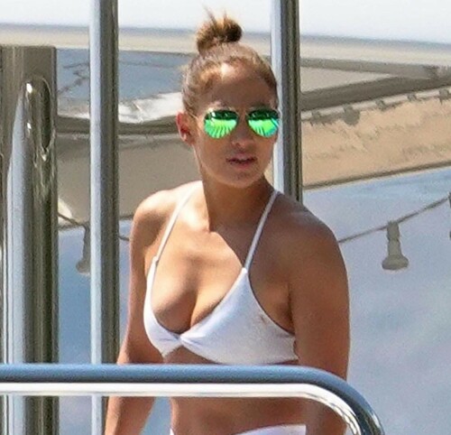 Jennifer Lopez | Workout on a yacht in Costiera Amalfitana Capri - August 7, 2018

SHIP SHAPE: Jennifer Lopez works out on the deck of a super-yacht on romantic holiday in Italy with boyfriend Alex Rodriguez

The singer/actress refused to let her holiday get in the way of her fitness regime as she cruised around the island of Capri with her man

JENNIFER Lopez looks ship shape working out on the deck of a super-yacht during a romantic holiday in Italy with her boyfriend Alex Rodriguez.

The singer/actress, 49, was pictured in a white bikini as she cruised around the island of Capri with her man.

Jennifer Lopez braved the heat by working out on the deck of a super-yacht

The couple chilled out on cushions as they soaked up the sun together on the luxury vessel during a trip down Italy's Amalfi Coast.

As well as taking in the lavish island of Capri, they also headed down to the town of Positano.

J-Lo was seen stretched out on the deck before leaning in to get close to her man.

However, the singer/actress can't sit about doing nothing for long and was later seen working out on deck despite the soaring temperatures.

Jennifer lifted weights as she kept up her gruelling fitness routine even though she's on holiday.

The couple's holiday comes just days after J-Lo sparked engagement rumours by flashing a huge diamond sparkler on her wedding ring finger.

The megastar celebrated her 49th birthday with baseball legend Alex, 42, in the Bahamas and wore the Cartier ring in holiday snaps shared on Instagram.

In one pic taken by her pal and photographer Ana Carballosa, J-Lo made no effort to hide the expensive silver ring and its unique intricate design made sure it was hard to miss.

Jen captioned her gallery of photos with a warm tribute to her family and fans - but didn't confirm if she's engaged.

She wrote: "So believe it or not I’m just waking up from my birthday celebration last night. It was a small gathering with the kids and some family and a couple of close friends...

"The day and night was filled with lots of laughter, tears and of course dancing...:) I wanted to write all of you bc I was so delighted and overwhelmed by the outpouring of love and birthday wishes you all sent to me yesterday!!

The Sun

#JenniferLopez #JLo