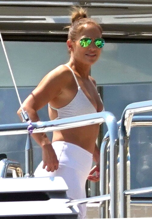 Jennifer Lopez | Workout on a yacht in Costiera Amalfitana Capri - August 7, 2018

SHIP SHAPE: Jennifer Lopez works out on the deck of a super-yacht on romantic holiday in Italy with boyfriend Alex Rodriguez

The singer/actress refused to let her holiday get in the way of her fitness regime as she cruised around the island of Capri with her man

JENNIFER Lopez looks ship shape working out on the deck of a super-yacht during a romantic holiday in Italy with her boyfriend Alex Rodriguez.

The singer/actress, 49, was pictured in a white bikini as she cruised around the island of Capri with her man.

Jennifer Lopez braved the heat by working out on the deck of a super-yacht

The couple chilled out on cushions as they soaked up the sun together on the luxury vessel during a trip down Italy's Amalfi Coast.

As well as taking in the lavish island of Capri, they also headed down to the town of Positano.

J-Lo was seen stretched out on the deck before leaning in to get close to her man.

However, the singer/actress can't sit about doing nothing for long and was later seen working out on deck despite the soaring temperatures.

Jennifer lifted weights as she kept up her gruelling fitness routine even though she's on holiday.

The couple's holiday comes just days after J-Lo sparked engagement rumours by flashing a huge diamond sparkler on her wedding ring finger.

The megastar celebrated her 49th birthday with baseball legend Alex, 42, in the Bahamas and wore the Cartier ring in holiday snaps shared on Instagram.

In one pic taken by her pal and photographer Ana Carballosa, J-Lo made no effort to hide the expensive silver ring and its unique intricate design made sure it was hard to miss.

Jen captioned her gallery of photos with a warm tribute to her family and fans - but didn't confirm if she's engaged.

She wrote: "So believe it or not I’m just waking up from my birthday celebration last night. It was a small gathering with the kids and some family and a couple of close friends...

"The day and night was filled with lots of laughter, tears and of course dancing...:) I wanted to write all of you bc I was so delighted and overwhelmed by the outpouring of love and birthday wishes you all sent to me yesterday!!

The Sun

#JenniferLopez #JLo