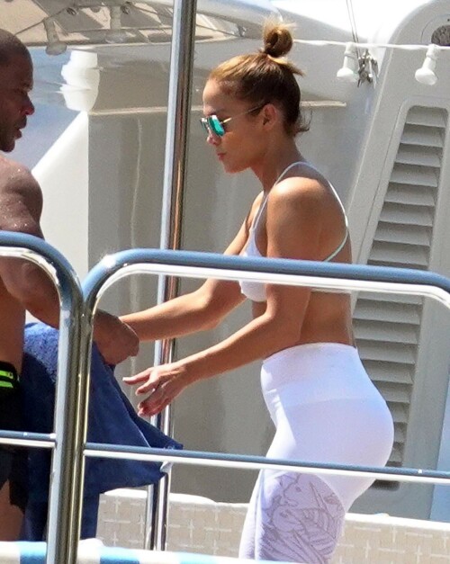 Jennifer Lopez | Workout on a yacht in Costiera Amalfitana Capri - August 7, 2018

SHIP SHAPE: Jennifer Lopez works out on the deck of a super-yacht on romantic holiday in Italy with boyfriend Alex Rodriguez

The singer/actress refused to let her holiday get in the way of her fitness regime as she cruised around the island of Capri with her man

JENNIFER Lopez looks ship shape working out on the deck of a super-yacht during a romantic holiday in Italy with her boyfriend Alex Rodriguez.

The singer/actress, 49, was pictured in a white bikini as she cruised around the island of Capri with her man.

Jennifer Lopez braved the heat by working out on the deck of a super-yacht

The couple chilled out on cushions as they soaked up the sun together on the luxury vessel during a trip down Italy's Amalfi Coast.

As well as taking in the lavish island of Capri, they also headed down to the town of Positano.

J-Lo was seen stretched out on the deck before leaning in to get close to her man.

However, the singer/actress can't sit about doing nothing for long and was later seen working out on deck despite the soaring temperatures.

Jennifer lifted weights as she kept up her gruelling fitness routine even though she's on holiday.

The couple's holiday comes just days after J-Lo sparked engagement rumours by flashing a huge diamond sparkler on her wedding ring finger.

The megastar celebrated her 49th birthday with baseball legend Alex, 42, in the Bahamas and wore the Cartier ring in holiday snaps shared on Instagram.

In one pic taken by her pal and photographer Ana Carballosa, J-Lo made no effort to hide the expensive silver ring and its unique intricate design made sure it was hard to miss.

Jen captioned her gallery of photos with a warm tribute to her family and fans - but didn't confirm if she's engaged.

She wrote: "So believe it or not I’m just waking up from my birthday celebration last night. It was a small gathering with the kids and some family and a couple of close friends...

"The day and night was filled with lots of laughter, tears and of course dancing...:) I wanted to write all of you bc I was so delighted and overwhelmed by the outpouring of love and birthday wishes you all sent to me yesterday!!

The Sun

#JenniferLopez #JLo