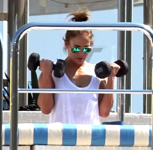 Jennifer Lopez | Workout on a yacht in Costiera Amalfitana Capri - August 7, 2018

SHIP SHAPE: Jennifer Lopez works out on the deck of a super-yacht on romantic holiday in Italy with boyfriend Alex Rodriguez

The singer/actress refused to let her holiday get in the way of her fitness regime as she cruised around the island of Capri with her man

JENNIFER Lopez looks ship shape working out on the deck of a super-yacht during a romantic holiday in Italy with her boyfriend Alex Rodriguez.

The singer/actress, 49, was pictured in a white bikini as she cruised around the island of Capri with her man.

Jennifer Lopez braved the heat by working out on the deck of a super-yacht

The couple chilled out on cushions as they soaked up the sun together on the luxury vessel during a trip down Italy's Amalfi Coast.

As well as taking in the lavish island of Capri, they also headed down to the town of Positano.

J-Lo was seen stretched out on the deck before leaning in to get close to her man.

However, the singer/actress can't sit about doing nothing for long and was later seen working out on deck despite the soaring temperatures.

Jennifer lifted weights as she kept up her gruelling fitness routine even though she's on holiday.

The couple's holiday comes just days after J-Lo sparked engagement rumours by flashing a huge diamond sparkler on her wedding ring finger.

The megastar celebrated her 49th birthday with baseball legend Alex, 42, in the Bahamas and wore the Cartier ring in holiday snaps shared on Instagram.

In one pic taken by her pal and photographer Ana Carballosa, J-Lo made no effort to hide the expensive silver ring and its unique intricate design made sure it was hard to miss.

Jen captioned her gallery of photos with a warm tribute to her family and fans - but didn't confirm if she's engaged.

She wrote: "So believe it or not I’m just waking up from my birthday celebration last night. It was a small gathering with the kids and some family and a couple of close friends...

"The day and night was filled with lots of laughter, tears and of course dancing...:) I wanted to write all of you bc I was so delighted and overwhelmed by the outpouring of love and birthday wishes you all sent to me yesterday!!

The Sun

#JenniferLopez #JLo