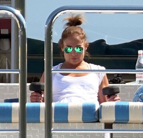 Jennifer Lopez | Workout on a yacht in Costiera Amalfitana Capri - August 7, 2018

SHIP SHAPE: Jennifer Lopez works out on the deck of a super-yacht on romantic holiday in Italy with boyfriend Alex Rodriguez

The singer/actress refused to let her holiday get in the way of her fitness regime as she cruised around the island of Capri with her man

JENNIFER Lopez looks ship shape working out on the deck of a super-yacht during a romantic holiday in Italy with her boyfriend Alex Rodriguez.

The singer/actress, 49, was pictured in a white bikini as she cruised around the island of Capri with her man.

Jennifer Lopez braved the heat by working out on the deck of a super-yacht

The couple chilled out on cushions as they soaked up the sun together on the luxury vessel during a trip down Italy's Amalfi Coast.

As well as taking in the lavish island of Capri, they also headed down to the town of Positano.

J-Lo was seen stretched out on the deck before leaning in to get close to her man.

However, the singer/actress can't sit about doing nothing for long and was later seen working out on deck despite the soaring temperatures.

Jennifer lifted weights as she kept up her gruelling fitness routine even though she's on holiday.

The couple's holiday comes just days after J-Lo sparked engagement rumours by flashing a huge diamond sparkler on her wedding ring finger.

The megastar celebrated her 49th birthday with baseball legend Alex, 42, in the Bahamas and wore the Cartier ring in holiday snaps shared on Instagram.

In one pic taken by her pal and photographer Ana Carballosa, J-Lo made no effort to hide the expensive silver ring and its unique intricate design made sure it was hard to miss.

Jen captioned her gallery of photos with a warm tribute to her family and fans - but didn't confirm if she's engaged.

She wrote: "So believe it or not I’m just waking up from my birthday celebration last night. It was a small gathering with the kids and some family and a couple of close friends...

"The day and night was filled with lots of laughter, tears and of course dancing...:) I wanted to write all of you bc I was so delighted and overwhelmed by the outpouring of love and birthday wishes you all sent to me yesterday!!

The Sun

#JenniferLopez #JLo