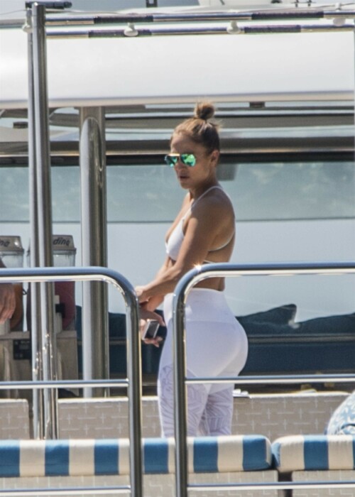 Jennifer Lopez | Workout on a yacht in Costiera Amalfitana Capri - August 7, 2018

SHIP SHAPE: Jennifer Lopez works out on the deck of a super-yacht on romantic holiday in Italy with boyfriend Alex Rodriguez

The singer/actress refused to let her holiday get in the way of her fitness regime as she cruised around the island of Capri with her man

JENNIFER Lopez looks ship shape working out on the deck of a super-yacht during a romantic holiday in Italy with her boyfriend Alex Rodriguez.

The singer/actress, 49, was pictured in a white bikini as she cruised around the island of Capri with her man.

Jennifer Lopez braved the heat by working out on the deck of a super-yacht

The couple chilled out on cushions as they soaked up the sun together on the luxury vessel during a trip down Italy's Amalfi Coast.

As well as taking in the lavish island of Capri, they also headed down to the town of Positano.

J-Lo was seen stretched out on the deck before leaning in to get close to her man.

However, the singer/actress can't sit about doing nothing for long and was later seen working out on deck despite the soaring temperatures.

Jennifer lifted weights as she kept up her gruelling fitness routine even though she's on holiday.

The couple's holiday comes just days after J-Lo sparked engagement rumours by flashing a huge diamond sparkler on her wedding ring finger.

The megastar celebrated her 49th birthday with baseball legend Alex, 42, in the Bahamas and wore the Cartier ring in holiday snaps shared on Instagram.

In one pic taken by her pal and photographer Ana Carballosa, J-Lo made no effort to hide the expensive silver ring and its unique intricate design made sure it was hard to miss.

Jen captioned her gallery of photos with a warm tribute to her family and fans - but didn't confirm if she's engaged.

She wrote: "So believe it or not I’m just waking up from my birthday celebration last night. It was a small gathering with the kids and some family and a couple of close friends...

"The day and night was filled with lots of laughter, tears and of course dancing...:) I wanted to write all of you bc I was so delighted and overwhelmed by the outpouring of love and birthday wishes you all sent to me yesterday!!

The Sun

#JenniferLopez #JLo