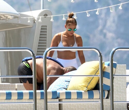 Jennifer Lopez | Workout on a yacht in Costiera Amalfitana Capri - August 7, 2018

SHIP SHAPE: Jennifer Lopez works out on the deck of a super-yacht on romantic holiday in Italy with boyfriend Alex Rodriguez

The singer/actress refused to let her holiday get in the way of her fitness regime as she cruised around the island of Capri with her man

JENNIFER Lopez looks ship shape working out on the deck of a super-yacht during a romantic holiday in Italy with her boyfriend Alex Rodriguez.

The singer/actress, 49, was pictured in a white bikini as she cruised around the island of Capri with her man.

Jennifer Lopez braved the heat by working out on the deck of a super-yacht

The couple chilled out on cushions as they soaked up the sun together on the luxury vessel during a trip down Italy's Amalfi Coast.

As well as taking in the lavish island of Capri, they also headed down to the town of Positano.

J-Lo was seen stretched out on the deck before leaning in to get close to her man.

However, the singer/actress can't sit about doing nothing for long and was later seen working out on deck despite the soaring temperatures.

Jennifer lifted weights as she kept up her gruelling fitness routine even though she's on holiday.

The couple's holiday comes just days after J-Lo sparked engagement rumours by flashing a huge diamond sparkler on her wedding ring finger.

The megastar celebrated her 49th birthday with baseball legend Alex, 42, in the Bahamas and wore the Cartier ring in holiday snaps shared on Instagram.

In one pic taken by her pal and photographer Ana Carballosa, J-Lo made no effort to hide the expensive silver ring and its unique intricate design made sure it was hard to miss.

Jen captioned her gallery of photos with a warm tribute to her family and fans - but didn't confirm if she's engaged.

She wrote: "So believe it or not I’m just waking up from my birthday celebration last night. It was a small gathering with the kids and some family and a couple of close friends...

"The day and night was filled with lots of laughter, tears and of course dancing...:) I wanted to write all of you bc I was so delighted and overwhelmed by the outpouring of love and birthday wishes you all sent to me yesterday!!

The Sun

#JenniferLopez #JLo