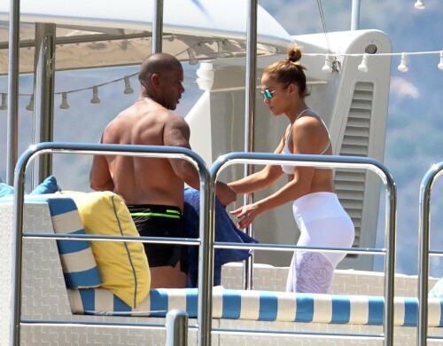 Jennifer Lopez | Workout on a yacht in Costiera Amalfitana Capri - August 7, 2018

SHIP SHAPE: Jennifer Lopez works out on the deck of a super-yacht on romantic holiday in Italy with boyfriend Alex Rodriguez

The singer/actress refused to let her holiday get in the way of her fitness regime as she cruised around the island of Capri with her man

JENNIFER Lopez looks ship shape working out on the deck of a super-yacht during a romantic holiday in Italy with her boyfriend Alex Rodriguez.

The singer/actress, 49, was pictured in a white bikini as she cruised around the island of Capri with her man.

Jennifer Lopez braved the heat by working out on the deck of a super-yacht

The couple chilled out on cushions as they soaked up the sun together on the luxury vessel during a trip down Italy's Amalfi Coast.

As well as taking in the lavish island of Capri, they also headed down to the town of Positano.

J-Lo was seen stretched out on the deck before leaning in to get close to her man.

However, the singer/actress can't sit about doing nothing for long and was later seen working out on deck despite the soaring temperatures.

Jennifer lifted weights as she kept up her gruelling fitness routine even though she's on holiday.

The couple's holiday comes just days after J-Lo sparked engagement rumours by flashing a huge diamond sparkler on her wedding ring finger.

The megastar celebrated her 49th birthday with baseball legend Alex, 42, in the Bahamas and wore the Cartier ring in holiday snaps shared on Instagram.

In one pic taken by her pal and photographer Ana Carballosa, J-Lo made no effort to hide the expensive silver ring and its unique intricate design made sure it was hard to miss.

Jen captioned her gallery of photos with a warm tribute to her family and fans - but didn't confirm if she's engaged.

She wrote: "So believe it or not I’m just waking up from my birthday celebration last night. It was a small gathering with the kids and some family and a couple of close friends...

"The day and night was filled with lots of laughter, tears and of course dancing...:) I wanted to write all of you bc I was so delighted and overwhelmed by the outpouring of love and birthday wishes you all sent to me yesterday!!

The Sun

#JenniferLopez #JLo