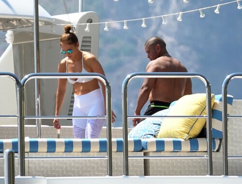 Jennifer Lopez | Workout on a yacht in Costiera Amalfitana Capri - August 7, 2018

SHIP SHAPE: Jennifer Lopez works out on the deck of a super-yacht on romantic holiday in Italy with boyfriend Alex Rodriguez

The singer/actress refused to let her holiday get in the way of her fitness regime as she cruised around the island of Capri with her man

JENNIFER Lopez looks ship shape working out on the deck of a super-yacht during a romantic holiday in Italy with her boyfriend Alex Rodriguez.

The singer/actress, 49, was pictured in a white bikini as she cruised around the island of Capri with her man.

Jennifer Lopez braved the heat by working out on the deck of a super-yacht

The couple chilled out on cushions as they soaked up the sun together on the luxury vessel during a trip down Italy's Amalfi Coast.

As well as taking in the lavish island of Capri, they also headed down to the town of Positano.

J-Lo was seen stretched out on the deck before leaning in to get close to her man.

However, the singer/actress can't sit about doing nothing for long and was later seen working out on deck despite the soaring temperatures.

Jennifer lifted weights as she kept up her gruelling fitness routine even though she's on holiday.

The couple's holiday comes just days after J-Lo sparked engagement rumours by flashing a huge diamond sparkler on her wedding ring finger.

The megastar celebrated her 49th birthday with baseball legend Alex, 42, in the Bahamas and wore the Cartier ring in holiday snaps shared on Instagram.

In one pic taken by her pal and photographer Ana Carballosa, J-Lo made no effort to hide the expensive silver ring and its unique intricate design made sure it was hard to miss.

Jen captioned her gallery of photos with a warm tribute to her family and fans - but didn't confirm if she's engaged.

She wrote: "So believe it or not I’m just waking up from my birthday celebration last night. It was a small gathering with the kids and some family and a couple of close friends...

"The day and night was filled with lots of laughter, tears and of course dancing...:) I wanted to write all of you bc I was so delighted and overwhelmed by the outpouring of love and birthday wishes you all sent to me yesterday!!

The Sun

#JenniferLopez #JLo