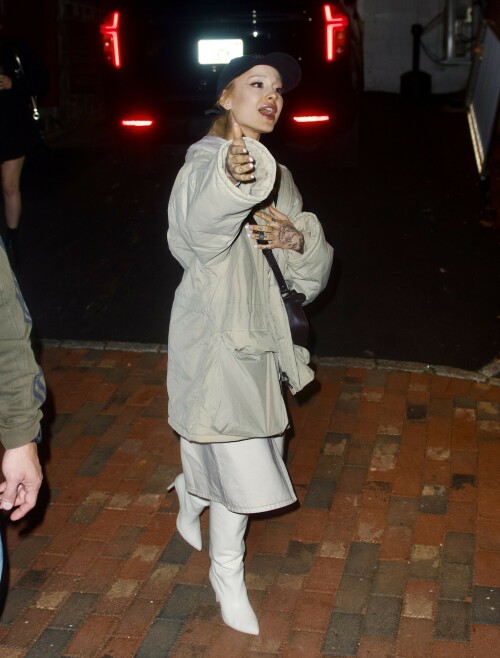 Ariana Grande was photographed going to see her brother, Frankie Grande, perform on stage for 'The Rocky Horror Show' in Pennsylvania - October 13, 2023

Ariana Grande is seen for the FIRST time since finalizing her divorce from Dalton Gomez while attending brother Frankie's performance of The Rocky Horror Picture Show in Pennsylvania

Ariana Grande appeared to be in great spirits on Friday evening as she was seen for the first time since her $1.25M divorce settlement with ex-husband Dalton Gomez was reached.

The 30-year-old songstress — who has moved on with Ethan Slater — stepped out in New Hope, Pennsylvania to see her brother Frankie Grande perform at Bucks County Playhouse.

The petite singer and actress was dressed in an oversized beige coat with a fuzzy cream-colored collar.

She covered her long blonde hair with a black baseball cap, letting a low ponytail flow out from underneath it.

Earlier this week it was revealed that Grande and Gomez had finalized the details of their split after two years of marriage.

The Florida-born musician added inches to her tiny frame in a pair of white to-the-knee stiletto boots.

A black tank top peeked out from underneath her outer layer, flashing a hint of her cleavage.

The fashionista coordinated the look with a midi length khaki skirt featuring a center slit.

The Wicked star's face was beautifully made up with sleek, precise black eyeliner and extended lashes.

She sported a rouge hue on her plump pout and flashed her cheek dimples as she smiled while greeting fans.

Ariana showed off a long, rounded French manicure on her ringless, tattooed hands.

And she carried a brown leather designer purse over her torso, crossbody-style.

Ariana and Dalton's settlement, which states Ariana will not be legally single until March 19, 2024, was said to have been smooth as the former couple had an iron-clad prenup.

Ariana, who has an estimated $240million net worth, is reportedly shacking up with Slater in NYC.

Meanwhile, Dalton was pictured kissing actress Maika Monroe earlier this week.

In lieu of spousal support, the real estate agent is receiving a single check from the Grammy winner — a tax-free $1,250,000 payment.

The singer will additionally pay $25k of Dalton's attorney fees.

Court documents obtained by The Blast state: 'The parties acknowledge that (Dalton) has been provided with thirty (30) days rent-free use of the Los Angeles Family Residence…and a tax-free payment of $1,250,000 from (Ariana)…in lieu of any spousal support payments being due.

'The parties acknowledge that there shall be no permanent spousal support payable by one party to the other party in this matter. This waiver of permanent spousal support is non-modifiable, irrespective of any changes in the parties’ respective health or financial circumstances.'

According to reports, the couple agreed to pay off the $6million mortgage of their Los Angeles home.

They will then put the property on the market and split the sale 50/50.

The former Nickelodeon star filed divorce paperwork last month on September 18 — with Dalton filing the same day.

In documents obtained by TMZ, Ariana's lawyer, Laura Wasser, cited 'irreconcilable differences' as the reason for the dissolution of the marriage, with the date of separation listed as February 20, 2023.

Sources informed the outlet that all was 'worked out' between the former couple 'before going to the courthouse.'

An insider explained to the outlet that the reason why the exes filed months after the separation was so that they could 'iron out details and settle.'

The proud younger sister took to Instagram on Saturday to congratulate Frankie on his new show.

She urged her followers, 'Everyone please run to see this incredible production of The Rocky Horror Show at @theaterbcp!!!'

The pop mogul added, 'You were hilarious and incredible @frankiegrande. brilliant cast & crew.'

Meanwhile, Frankie also dropped in on social media to mark their grandmother's birthday.

Engaging his two million followers, he wrote, 'Happy birthday to our superstar Nonna! 98 with the spirit of a 19 year old - we love you to the ends of the universe and back.'

Daily Mail

#ArianaGrande