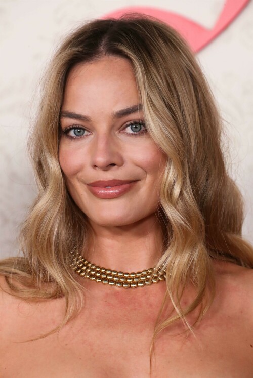 Margot Robbie at the premiere of 'Saltburn' in Los Angeles - November 14, 2023

Margot Robbie loses voice at her first premiere since US actors’ strike

Margot Robbie used hand gestures to explain she had lost her voice and could not be interviewed at her first red carpet premiere since the start of the US actors’ strike in July.

The Barbie actress appeared at the premiere of Saltburn in Los Angeles on Tuesday, having co-produced the thriller alongside Josey McNamara, directed by The Crown actress and Oscar-winning filmmaker Emerald Fennell.

Robbie led the star-studded cast, including Barry Keoghan and Jacob Elordi, on the red carpet for the first time since the start of the Sag-Aftra US actors’ strike which ended last week after an 118-day shutdown.

When asked to be interviewed, 33-year-old Robbie gestured to her throat and shrugged her shoulders to explain she had lost her voice, which was later confirmed by her representatives.

The Australian actress last appeared at the London premiere of Barbie alongside co-star Ryan Gosling just two days before the strikes brought an end to stars attending premieres.

Speaking of his co-producer, McNamara told the PA news agency: “It was great, very proud of the movie, feel happy we are here. It’s been a long process, feels like it’s been a long time but very happy for people to see it.

“I love Emerald, I love Margot, they’re both amazing so it just makes it fun to go to work.”

The Barbie and Promising Young Women producer – which won Fennell an Academy Award, added on the strikes: “It’s great to have them (the cast) back, it’s the dream to have a premiere, we made the move together so it’s great that they get to come and celebrate with us.”

The thriller, which opened the BFI London Film Festival without its cast in October due to the strikes, stars Oscar-nominated actor Keoghan as student Oliver Quick who struggles to find his place at Oxford University.

He finds himself drawn into the world of the charming and aristocratic Felix Catton (Elordi) who invites Oliver to his eccentric family’s sprawling estate in Saltburn, where he becomes infatuated with the aristocrat.

The film, which is set for release on November 17, also stars Rosamund Pike and Richard E Grant, as well as British star Carey Mulligan who also appeared at the red carpet premiere at the Theatre at Ace Hotel in Los Angeles.

British singer-songwriter Sophie Ellis-Bextor also graced the red carpet, after director Fennell decided to incorporate her 2001 hit Murder On The Dancefloor into the end of the film.

Ellis-Bextor, who is performing the song at the premiere’s after party, told PA: “My song is in the movie, (it is) involved in quite an unusual way. I really liked it, and it also made me laugh and I just can’t wait for other people to see it now.

“I didn’t know Emerald…I knew she was a big talent and it was a lovely thing to be approached. I saw a little synopsis of how the song would be used in the movie and that was enough really, I was sold.

“When I finally saw the movie I loved it but also it’s really lovely to have a song like Murder (On The Dancefloor) that I’ve been singing for over 20 years and so surprised by it’s new interpretation.”

“A character dances to it in a way I’ve never seen before and if it takes off it’s going to give me a lot to process the next time I’m doing it on stage,” she added.

British composer Anthony Willis, who wrote the score to Saltburn, told PA “it is such an English movie”.

“Obviously I loved the script so much and then getting to see Emerald’s first directors cut with just her incredible work all the amazing performances and all these character’s brought to life blew me away,” he said.

“And then getting to create the score to accompany Oliver on his crazy summer journey of lust and longing and puzzles and all of the above was so much fun.”

yahoo

#MargotRobbie