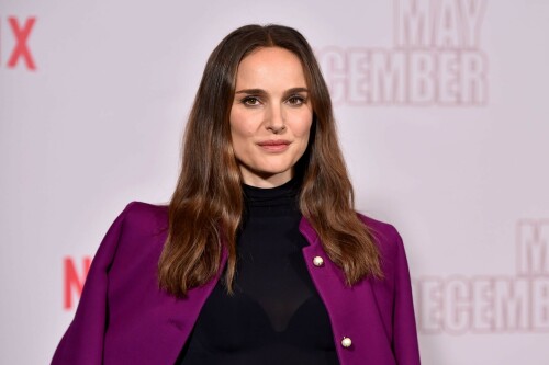 Natalie Portman | Netflix's 'May December' Photocall, Los Angeles - November 17, 2023

Natalie Portman gets leggy in sequin miniskirt and fitted black top alongside co-star Julianne Moore at photocall for new film May December in LA

Natalie Portman, Julianne Moore, and members of the cast and crew for May December are on full-on promotional mode for the new film from director Todd Haynes.

On Friday, the two A-list Oscar winners attended Netflix's Los Angeles Photo Call for the black comedy-drama that was held at the Four Seasons Hotel in Beverly Hills.

The actresses were joined by their co-star Charles Melton, along with Haynes, for the photocall, which came one day after the film's Los Angeles premiere at the Academy Museum of Motion Pictures.

For a second day in a row, Portman appeared to go solo and not wear her wedding ring on the red carpet, in the wake of cheating allegations waged against her husband Benjamin Millepied in recent months.

While she opted to keep the accessories to a minimum, Portman showed off her petite figure and fashion sense by stepping out in a sequin miniskirt that glistened under the lights of the event, and a black form-fitted top.

The miniskirt was predominantly black and silver, but the garment also had touches of purple, white and burgundy.

The Jerusalem, Israel native, who grew up in Washington, D.C., Connecticut and Long Island, New York, also wore a purple jacket over her shoulder at times during the photocall.

Rounding out her overall look, the Oscar-winning actress also donned a pair of black open-toe heels, and had her dark brown locks styled long with some natural waves and a part in the middle.

After striking a number of poses by herself, Portman was then joined on the red carpet by Moore, who was decked out in an all-black ensemble consisting of a long skirt and a matching short-sleeve top that hugged her fit figure.

She also wore a pair of black open-toe heels, and had her ginger tresses flowing long and straight a few inches down her back with a center part.

Moore, a Fort Bragg, North Carolina native who moved around the U.S. a lot as the child of a military father, would also pose for photographers by herself.

At one point, Haynes and Melton joined in on the red carpet fun, with the actor dressed in black high-water pants, a gray sweater and black combat-style boots, and the filmmaker wearing blue jeans, a black button-down shirt and matching sneakers.

In May December, Portman plays Elizabeth Berry, a famous actress preparing for a role who travels to Savannah to meet Gracie (Julianne Moore), a character loosely inspired by Mary Kay Letourneau, according to Variety. During her stay, Elizabeth develops ambivalent feelings towards Gracie and her 30-something husband Joe, with whom she started having an unlawful relationship when he was 13.

Directed by Todd Haynes from a screenplay by Samy Burch that's based on a story by Burch and Alex Mechanik, the black comedy-drama film also stars Melton, along with D. W. Moffett, Piper Curda, Elizabeth Yu, Gabriel Chung, Cory Michael Smith and Lawrence Arancio.

The previous day, both Portman and Moore attended the Los Angeles premiere of May December at the Academy Museum of Motion Pictures.

The Black Swan star donned a black strapless dress that featured a bold feather embellishment, a pair of black ankle strap heels, and her hair styled long and straight.

And like she did on Friday, Portman was again noticeably not wearing her wedding ring, amid all the talk of Millepied's affair with climate activist Camille Etienne.

Their marriage was the subject of an article in the French publication, Voici, which claimed the French dancer and choreographer, 46, had an affair with the then 25-year-old.

'It was short-lived and it is over,' a source said when the news of the cheating broke earlier this year.

The actress has been seen without her wedding ring a number of times since then, and though there were rumors of a separation, the couple has been out together as they parent their two kids over the course of the last six months.

May December, which has received praise from critics, was released in select theaters in the U.S on November 17, before it starts to stream on Netflix on December 1.

DailyMail

#NataliePortman