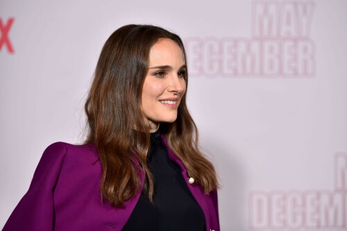 Natalie Portman | Netflix's 'May December' Photocall, Los Angeles - November 17, 2023

Natalie Portman gets leggy in sequin miniskirt and fitted black top alongside co-star Julianne Moore at photocall for new film May December in LA

Natalie Portman, Julianne Moore, and members of the cast and crew for May December are on full-on promotional mode for the new film from director Todd Haynes.

On Friday, the two A-list Oscar winners attended Netflix's Los Angeles Photo Call for the black comedy-drama that was held at the Four Seasons Hotel in Beverly Hills.

The actresses were joined by their co-star Charles Melton, along with Haynes, for the photocall, which came one day after the film's Los Angeles premiere at the Academy Museum of Motion Pictures.

For a second day in a row, Portman appeared to go solo and not wear her wedding ring on the red carpet, in the wake of cheating allegations waged against her husband Benjamin Millepied in recent months.

While she opted to keep the accessories to a minimum, Portman showed off her petite figure and fashion sense by stepping out in a sequin miniskirt that glistened under the lights of the event, and a black form-fitted top.

The miniskirt was predominantly black and silver, but the garment also had touches of purple, white and burgundy.

The Jerusalem, Israel native, who grew up in Washington, D.C., Connecticut and Long Island, New York, also wore a purple jacket over her shoulder at times during the photocall.

Rounding out her overall look, the Oscar-winning actress also donned a pair of black open-toe heels, and had her dark brown locks styled long with some natural waves and a part in the middle.

After striking a number of poses by herself, Portman was then joined on the red carpet by Moore, who was decked out in an all-black ensemble consisting of a long skirt and a matching short-sleeve top that hugged her fit figure.

She also wore a pair of black open-toe heels, and had her ginger tresses flowing long and straight a few inches down her back with a center part.

Moore, a Fort Bragg, North Carolina native who moved around the U.S. a lot as the child of a military father, would also pose for photographers by herself.

At one point, Haynes and Melton joined in on the red carpet fun, with the actor dressed in black high-water pants, a gray sweater and black combat-style boots, and the filmmaker wearing blue jeans, a black button-down shirt and matching sneakers.

In May December, Portman plays Elizabeth Berry, a famous actress preparing for a role who travels to Savannah to meet Gracie (Julianne Moore), a character loosely inspired by Mary Kay Letourneau, according to Variety. During her stay, Elizabeth develops ambivalent feelings towards Gracie and her 30-something husband Joe, with whom she started having an unlawful relationship when he was 13.

Directed by Todd Haynes from a screenplay by Samy Burch that's based on a story by Burch and Alex Mechanik, the black comedy-drama film also stars Melton, along with D. W. Moffett, Piper Curda, Elizabeth Yu, Gabriel Chung, Cory Michael Smith and Lawrence Arancio.

The previous day, both Portman and Moore attended the Los Angeles premiere of May December at the Academy Museum of Motion Pictures.

The Black Swan star donned a black strapless dress that featured a bold feather embellishment, a pair of black ankle strap heels, and her hair styled long and straight.

And like she did on Friday, Portman was again noticeably not wearing her wedding ring, amid all the talk of Millepied's affair with climate activist Camille Etienne.

Their marriage was the subject of an article in the French publication, Voici, which claimed the French dancer and choreographer, 46, had an affair with the then 25-year-old.

'It was short-lived and it is over,' a source said when the news of the cheating broke earlier this year.

The actress has been seen without her wedding ring a number of times since then, and though there were rumors of a separation, the couple has been out together as they parent their two kids over the course of the last six months.

May December, which has received praise from critics, was released in select theaters in the U.S on November 17, before it starts to stream on Netflix on December 1.

DailyMail

#NataliePortman