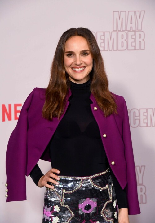 Natalie Portman | Netflix's 'May December' Photocall, Los Angeles - November 17, 2023

Natalie Portman gets leggy in sequin miniskirt and fitted black top alongside co-star Julianne Moore at photocall for new film May December in LA

Natalie Portman, Julianne Moore, and members of the cast and crew for May December are on full-on promotional mode for the new film from director Todd Haynes.

On Friday, the two A-list Oscar winners attended Netflix's Los Angeles Photo Call for the black comedy-drama that was held at the Four Seasons Hotel in Beverly Hills.

The actresses were joined by their co-star Charles Melton, along with Haynes, for the photocall, which came one day after the film's Los Angeles premiere at the Academy Museum of Motion Pictures.

For a second day in a row, Portman appeared to go solo and not wear her wedding ring on the red carpet, in the wake of cheating allegations waged against her husband Benjamin Millepied in recent months.

While she opted to keep the accessories to a minimum, Portman showed off her petite figure and fashion sense by stepping out in a sequin miniskirt that glistened under the lights of the event, and a black form-fitted top.

The miniskirt was predominantly black and silver, but the garment also had touches of purple, white and burgundy.

The Jerusalem, Israel native, who grew up in Washington, D.C., Connecticut and Long Island, New York, also wore a purple jacket over her shoulder at times during the photocall.

Rounding out her overall look, the Oscar-winning actress also donned a pair of black open-toe heels, and had her dark brown locks styled long with some natural waves and a part in the middle.

After striking a number of poses by herself, Portman was then joined on the red carpet by Moore, who was decked out in an all-black ensemble consisting of a long skirt and a matching short-sleeve top that hugged her fit figure.

She also wore a pair of black open-toe heels, and had her ginger tresses flowing long and straight a few inches down her back with a center part.

Moore, a Fort Bragg, North Carolina native who moved around the U.S. a lot as the child of a military father, would also pose for photographers by herself.

At one point, Haynes and Melton joined in on the red carpet fun, with the actor dressed in black high-water pants, a gray sweater and black combat-style boots, and the filmmaker wearing blue jeans, a black button-down shirt and matching sneakers.

In May December, Portman plays Elizabeth Berry, a famous actress preparing for a role who travels to Savannah to meet Gracie (Julianne Moore), a character loosely inspired by Mary Kay Letourneau, according to Variety. During her stay, Elizabeth develops ambivalent feelings towards Gracie and her 30-something husband Joe, with whom she started having an unlawful relationship when he was 13.

Directed by Todd Haynes from a screenplay by Samy Burch that's based on a story by Burch and Alex Mechanik, the black comedy-drama film also stars Melton, along with D. W. Moffett, Piper Curda, Elizabeth Yu, Gabriel Chung, Cory Michael Smith and Lawrence Arancio.

The previous day, both Portman and Moore attended the Los Angeles premiere of May December at the Academy Museum of Motion Pictures.

The Black Swan star donned a black strapless dress that featured a bold feather embellishment, a pair of black ankle strap heels, and her hair styled long and straight. 

And like she did on Friday, Portman was again noticeably not wearing her wedding ring, amid all the talk of Millepied's affair with climate activist Camille Etienne.

Their marriage was the subject of an article in the French publication, Voici, which claimed the French dancer and choreographer, 46, had an affair with the then 25-year-old. 

'It was short-lived and it is over,' a source said when the news of the cheating broke earlier this year.

The actress has been seen without her wedding ring a number of times since then, and though there were rumors of a separation, the couple has been out together as they parent their two kids over the course of the last six months.

May December, which has received praise from critics, was released in select theaters in the U.S on November 17, before it starts to stream on Netflix on December 1. 

DailyMail

#NataliePortman