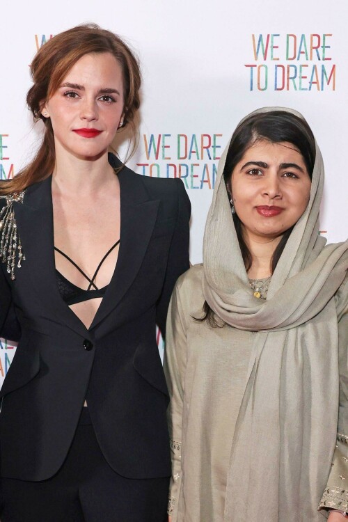 Emma Watson | 'We Dare to Dream' Premiere in London, UK - November 26, 2023

Emma Watson dazzles in a plunging black suit as she poses with Malala Yousafzai at the premiere of We Dare To Dream

Emma Watson dazzled in a plunging black suit at the We Dare To Dream premiere in London on Sunday evening.

The Harry Potter actress, 33, looked radiant as she joined Malala Yousafzai at the event at Cineworld Leicester Square.

Emma opted for an all-black number, flashing a black bralette under her suit, which was embellished with sequins at the shoulder.

The screen star also posed with the film's director Waad Al-Kateab and producer Joe Gebbia.

Also in attendance was Emma's Harry Potter co-star Jason Isaacs, who played Lucius Malfoy in the wizarding series.

Jason looked laid-back in a zip-up hoodie and jeans - but added a blazer for his evening out.

James Corden appeared in high spirits in a black blazer with red trimmings and buttons - after making the move from America back to the UK.

We Dare To Dream sees Refugee athletes face dramatic challenges while competing for a place in the 2020 Olympic Games.

The film features an original song Don't Need to Sleep performed by John Legend, while Angelina Jolie and Legend are two of the executive producers.

The athletes from Iran, Syria, South Sudan and Cameroon all seek to make it as they train to compete on the world stage, revealing a breadth of backgrounds, personal stories and Olympic sports.

It shows the fire and the drive of young people forced to leave their families, homes and countries of birth to build new lives out of nothing.

Culminating in their competition at the summer Olympics, their compatriots back home and their new communities in refugee camps watch as these determined young athletes fight for their place in the world.

Emma took some time out for the special evening from her busy studies at Oxford University, where she is currently focusing on master's degree in creative writing.

Her plans to study creative writing were revealed in an interview with the Financial Times in April, in which it was reported that she had begun writing poetry during lockdown as well as essays on love, friendship and relationships.

Her studies are thought to be part-time and mostly online.

However she caused a stir when she appeared in person for the university's matriculation ceremony at the start of the academic year, as students rushed to take photos of the famous star.

She also spent a year attending Worcester College at Oxford as an undergraduate in the 2011/12 academic year.

This was during the course of her English literature degree at Brown University in Rhode Island, from where she graduated in 2014.

The Oxford University website states that the creative writing master's course runs for two years and costs £9,025 a year for UK students and £14,155 a year for those from overseas.

Emma spent much of her childhood in Oxfordshire, living there with her mother Jacqueline from the age of five and attending Dragon School and Headington School in the city.

Daily Mail

#EmmaWatson