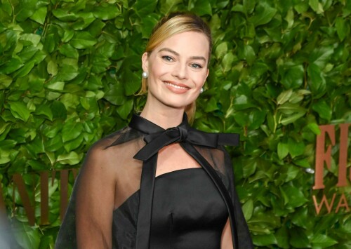 Margot Robbie attends the 33rd Annual Gotham Awards at Cipriani Wall Street, New York City - November 27, 2023

Margot Robbie Wears All-Black Barbie-Inspired Look to Gotham Awards with Husband Tom Ackerley

Robbie and Ackerley produced 'Barbie,' which received one nomination and one tribute at the awards ceremony

Margot Robbie wore another Barbie-inspired look to the Gotham Awards, but one without pink.

The Barbie actress, 33, attended the awards ceremony with her husband, Tom Ackerley, 33, in an all-black look that included a sheer cape.

Robbie's stylist, Andrew Mukamal, shared a photo of the "Black Magic Ensemble" that her latest look draws inspiration from on Instagram. The Oscar nominee has been wearing looks that bring Barbie dolls to life throughout the Barbie press tour that began over the summer.

The Gotham Awards is showing love to Barbie this year. Ryan Gosling is nominated for outstanding supporting performance for his role as Ken. Greta Gerwig will receive the global icon and creator tribute for her work as director of the film.

Ackerley and Robbie are both producers of Barbie, as co-founders of production company LuckyChap Entertainment.

Margot Robbie's Cutest Moments with Her Husband, Tom Ackerley
Robbie has often hit the red carpet in Barbie-inspired looks since the film premiered in July. At the world premiere, Robbie and Ackerley — who have been married since 2016 — stepped out in matching black tie.

Robbie wore a sequined black dress, opera gloves and a diamond necklace, replicating a 1960s Barbie doll. Ackerley kept it classic in a black tux.

For the Seoul premiere, the actress channeled ‘80s Day to Night Barbie. Robbie arrived in a hot pink skirt, sparkling top and pink heels.

Later in the night, Robbie beamed in a hot pink suit, pink tie and polka-dot fedora. To set off the look, the actress carried a hot pink handbag and sparkly retro cell phone.

In July, Robbie explained the not-so-subtle approach to Barbie dressing.
“We're finding Barbie references from decades past and just doing it really for the big Barbie fans out there, people who are actually collecting those Barbies. We're hoping to get them excited,” Robbie told PEOPLE exclusively. “We're pairing Barbie references with great designers.”

Barbie scored huge at the box office and received widespread praise from fans and critics alike. At a Barbie Q&A in early November, Gerwig said the acclaim is hard to take in.

"This definitely feels like a moment that I could potentially wake up from and think, 'No, that was a dream,'” Gerwig said.

People

#MargotRobbie