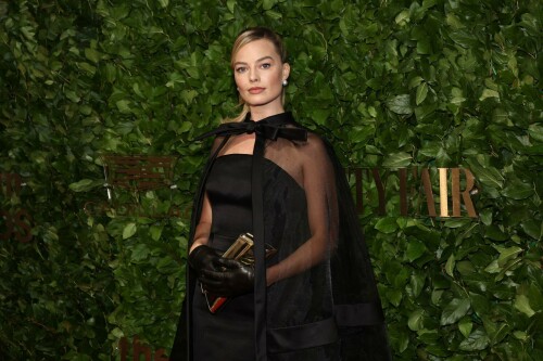 Margot Robbie attends the 33rd Annual Gotham Awards at Cipriani Wall Street, New York City - November 27, 2023

Margot Robbie Wears All-Black Barbie-Inspired Look to Gotham Awards with Husband Tom Ackerley

Robbie and Ackerley produced 'Barbie,' which received one nomination and one tribute at the awards ceremony

Margot Robbie wore another Barbie-inspired look to the Gotham Awards, but one without pink.

The Barbie actress, 33, attended the awards ceremony with her husband, Tom Ackerley, 33, in an all-black look that included a sheer cape.

Robbie's stylist, Andrew Mukamal, shared a photo of the "Black Magic Ensemble" that her latest look draws inspiration from on Instagram. The Oscar nominee has been wearing looks that bring Barbie dolls to life throughout the Barbie press tour that began over the summer.

The Gotham Awards is showing love to Barbie this year. Ryan Gosling is nominated for outstanding supporting performance for his role as Ken. Greta Gerwig will receive the global icon and creator tribute for her work as director of the film.

Ackerley and Robbie are both producers of Barbie, as co-founders of production company LuckyChap Entertainment.

Margot Robbie's Cutest Moments with Her Husband, Tom Ackerley
Robbie has often hit the red carpet in Barbie-inspired looks since the film premiered in July. At the world premiere, Robbie and Ackerley — who have been married since 2016 — stepped out in matching black tie.

Robbie wore a sequined black dress, opera gloves and a diamond necklace, replicating a 1960s Barbie doll. Ackerley kept it classic in a black tux.

For the Seoul premiere, the actress channeled ‘80s Day to Night Barbie. Robbie arrived in a hot pink skirt, sparkling top and pink heels.

Later in the night, Robbie beamed in a hot pink suit, pink tie and polka-dot fedora. To set off the look, the actress carried a hot pink handbag and sparkly retro cell phone.

In July, Robbie explained the not-so-subtle approach to Barbie dressing.
“We're finding Barbie references from decades past and just doing it really for the big Barbie fans out there, people who are actually collecting those Barbies. We're hoping to get them excited,” Robbie told PEOPLE exclusively. “We're pairing Barbie references with great designers.”

Barbie scored huge at the box office and received widespread praise from fans and critics alike. At a Barbie Q&A in early November, Gerwig said the acclaim is hard to take in.

"This definitely feels like a moment that I could potentially wake up from and think, 'No, that was a dream,'” Gerwig said.

People

#MargotRobbie