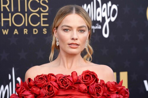 Margot Robbie | 29th Annual Critics Choice Awards in Santa Monica - 14.01.2024

Margot Robbie Brings Radiant Rose Barbie Alive in Red Balmain Dress at the Critics Choice Awards

Dua Lipa isn’t the only Barbie cast member to dress like a rose for the Critics Choice Awards. Best Actress nominee Margot Robbie attended the ceremony in her own rose-adorned look: a custom red Balmain column dress. She acessorized with Lorraine Schwartz jewelry. Her husband, Tom Ackerley, posed with her in a rare red carpet appearance for the couple. Fans speculated that she could be referencing 1996’s Radiant Rose Barbie with the outfit as the top part greatly resembles the Barbie’s red dress.

Barbie is up for 18 awards at the ceremony tonight. Robbie herself is up for Best Actress for her work in the film.

Robbie spoke to Deadline in a cover story released earlier this week about how they approached making a movie about Barbie given people’s different opinions about the doll.

She said:

We really didn’t want to avoid or appease anyone in particular. I feel that whenever characters or movies hit and feel successful, they’re holding up a mirror to the audience. Art is a way for us to understand ourselves: “By analyzing this character and their behavior, and the circumstances they’re in, I’m now able to make sense of something in my life.” That’s what I think every movie should strive to do, because you have to make it feel personal for the audience. You’ve got to make it resonate with them.

That’s not to say we all sat down trying to figure out the puzzle as you describe it. All I knew going into it was that there was an opportunity here to do that thing. It took a really smart person like Greta Gerwig to find the story, and figure out how to unpack all those things. I knew she wouldn’t be glossing over the spiky bits, which was important in our writer/director. I knew she wouldn’t be interested in doing that. She always wanted to explore both the good and the bad, because you don’t get a fully formed experience without looking at both.

But at the same time, and most important of all, it was about finding a person—and I always knew it should be Greta—who would be able to do it without mocking anything. Overall, it was important that it not be mean-spirited. It always had to come from a place of love. And I think it was about making it feel hopeful. It felt like we could hold the spiky bits and the warmth in the same hands.

At the end of the day, the movie is kind of not really about Barbie. Greta’s the genius that looked at it and went, “Aren’t humans so strange? They made a doll, then they got mad at the doll. That’s just insane.” And it’s true; we created Barbie and then we got mad at Barbie, because then we didn’t have to get mad at ourselves. We could shout at her; we could project onto her all of the perceived failings in the world, and we could direct the blame at her. It’s an inanimate object [laughs]. Isn’t that just so crazy?

I can’t claim any of these thoughts were fully fleshed out when I went after the rights for Barbie. But I knew someone would have those thoughts, and I recognized the opportunity and the kind of playground that someone smart like a Greta Gerwig could have fun in.

ELLE

#MargotRobbie