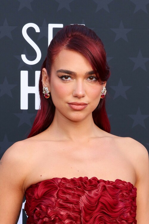 Dua Lipa | 29th Annual Critics Choice Awards In Santa Monica - 14.01.2024

Dua Lipa Dressed Like a Literal English Rose in a Red Floral Dress at the Critics Choice Awards

After making a bold sartorial statement at last weekend’s Golden Globes, Dua Lipa continued her award season fashion run at tonight’s Critics Choice Awards. Lipa is up for Best Song for Barbie’s “Dance the Night.” Barbie itself has 18 nominations at the ceremony, including for Best Acting Ensemble and Best Picture. Lipa played Mermaid Barbie in the film, making her part of that nominated group.

On the red carpet, Lipa leaned into a literal English rose aesthetic, wearing a red Prada column dress with floral detailing. She wore her red hair half up, half down. Lipa accessorized with Jean Schlumberger by Tiffany& Co. earrings.

Lipa’s outing tonight comes after the singer sparked dating rumors with actor Callum Turner. A source claimed to Page Six that Turner and Lipa are a couple. “It’s new, but they’re mad about each other,” that source alleged.

In December, Lipa spoke to Vanity Fair about the success of Barbie. “The thing is, Greta [Gerwig, the film’s director] just really defied all odds,” she said. “Nobody knew what to expect from the Barbie film and for it to be able to hit so many chords, from it being so fun and happy and funny, to then really hitting the heartstrings and touching on something really emotional and having you, especially as a woman, contemplate your place and what’s expected of you.”

She also reflected on the process of writing “Dance the Night” and what it taught her. “Because writing for film isn’t something that I’ve done before, that was when I realized the power of possibly being able to write lyrics like a score,” she said. “I can basically narrate a story, and narrate what’s happening in the scene, to really merge the two worlds together, the music and the movie. [The song] can be its own stand-alone thing, but also when together it’s 100 percent tailored for that very moment in the film.”

ELLE

#DuaLipa