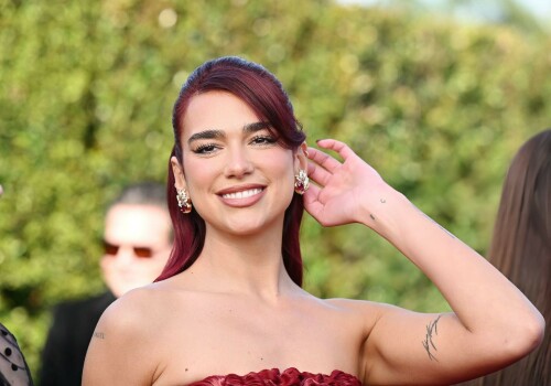 Dua Lipa | 29th Annual Critics Choice Awards In Santa Monica - 14.01.2024

Dua Lipa Dressed Like a Literal English Rose in a Red Floral Dress at the Critics Choice Awards

After making a bold sartorial statement at last weekend’s Golden Globes, Dua Lipa continued her award season fashion run at tonight’s Critics Choice Awards. Lipa is up for Best Song for Barbie’s “Dance the Night.” Barbie itself has 18 nominations at the ceremony, including for Best Acting Ensemble and Best Picture. Lipa played Mermaid Barbie in the film, making her part of that nominated group.

On the red carpet, Lipa leaned into a literal English rose aesthetic, wearing a red Prada column dress with floral detailing. She wore her red hair half up, half down. Lipa accessorized with Jean Schlumberger by Tiffany& Co. earrings.

Lipa’s outing tonight comes after the singer sparked dating rumors with actor Callum Turner. A source claimed to Page Six that Turner and Lipa are a couple. “It’s new, but they’re mad about each other,” that source alleged.

In December, Lipa spoke to Vanity Fair about the success of Barbie. “The thing is, Greta [Gerwig, the film’s director] just really defied all odds,” she said. “Nobody knew what to expect from the Barbie film and for it to be able to hit so many chords, from it being so fun and happy and funny, to then really hitting the heartstrings and touching on something really emotional and having you, especially as a woman, contemplate your place and what’s expected of you.”

She also reflected on the process of writing “Dance the Night” and what it taught her. “Because writing for film isn’t something that I’ve done before, that was when I realized the power of possibly being able to write lyrics like a score,” she said. “I can basically narrate a story, and narrate what’s happening in the scene, to really merge the two worlds together, the music and the movie. [The song] can be its own stand-alone thing, but also when together it’s 100 percent tailored for that very moment in the film.”

ELLE

#DuaLipa