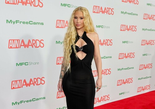 Iggy Azalea performs during 2024 Adult Video News Awards at Resorts World Las Vegas in Las Vegas - 27.01.2024

Iggy Azalea stuns in sleek black frock as she attends Adult Video News Awards in Las Vegas after quitting music career

Iggy Azalea cut a relatively modest figure as she attended a racy awards ceremony on Saturday night.

The Australian rapper, 33, stepped out for the 2024 Adult Video News Awards in Las Vegas, Nevada in a sleek black frock.

The dress featured peekaboo cutouts that flaunted a hint of bust and clung close to the performer's famous curves.

Iggy added a pair of nude high heels which matched her lip gloss and kept her accessories to a bracelet and a number of rings.

The blonde wore her long hair down in soft curls an opted for a clean makeup look with a peachy blush.

Iggy had earlier announced that she would be performing at the X-rated awards ceremony that celebrates the top performers in the porn industry.

'I'm thrilled to be performing at the AVN Awards—a celebration of passion, fearlessness, and artistic expression,' Iggy said in a statement.

'I can't wait to deliver a show that embodies the spirit of liberation and creative freedom. Let's make this an unforgettable night!'

It comes after Iggy quit the music industry, ten years after she shot to global fame with her song Fancy.

Iggy shared the shock announcement via X (formerly Twitter) earlier this month, penning a lengthy message to her fans about her plans to focus on other creative endeavours.

She also confirmed in her post she would no longer be finishing her upcoming fourth album.

'I know a lot of people have this idea that I was "bullied away from music" and that's something I've always laughed at because I'd never be bullied out of anything! In fact, I'm too stubborn,' Iggy began.

'I think I've even resisted changes within myself at times, purely because I don't like being viewed as someone who quits.'

Iggy, who recently announced she had come out of 'retirement' to pen a fourth album, said she now feels 'more passionately about design and creative direction' than she does about writing music.

'To many of you that's no shock to read. It shows in my work. Haha! Jokes aside, I do spend a lot more time on that part of things… because I'm most confident at that.'

'That's why I want to let you know that I'm not going to finish my album,' she continued.

Iggy said the album had been stalled in recent months while she was 'giving direction for a different project', and that she hasn't felt the 'urge' to get back to writing.

'I feel really happy and passionate in my day to day life when my mind's focused on that and so I want to stick to what's undeniably best for me,' she said.

The Mo Bounce hitmaker concluded by apologising to her fans, writing: 'I know for some fans this probably makes you feel a little deflated - I'm sorry to let you down.'

DailyMail

#IggyAzalea