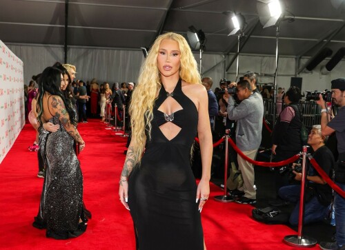 Iggy Azalea performs during 2024 Adult Video News Awards at Resorts World Las Vegas in Las Vegas - 27.01.2024

Iggy Azalea stuns in sleek black frock as she attends Adult Video News Awards in Las Vegas after quitting music career

Iggy Azalea cut a relatively modest figure as she attended a racy awards ceremony on Saturday night.

The Australian rapper, 33, stepped out for the 2024 Adult Video News Awards in Las Vegas, Nevada in a sleek black frock.

The dress featured peekaboo cutouts that flaunted a hint of bust and clung close to the performer's famous curves.

Iggy added a pair of nude high heels which matched her lip gloss and kept her accessories to a bracelet and a number of rings.

The blonde wore her long hair down in soft curls an opted for a clean makeup look with a peachy blush.

Iggy had earlier announced that she would be performing at the X-rated awards ceremony that celebrates the top performers in the porn industry.

'I'm thrilled to be performing at the AVN Awards—a celebration of passion, fearlessness, and artistic expression,' Iggy said in a statement.

'I can't wait to deliver a show that embodies the spirit of liberation and creative freedom. Let's make this an unforgettable night!'

It comes after Iggy quit the music industry, ten years after she shot to global fame with her song Fancy.

Iggy shared the shock announcement via X (formerly Twitter) earlier this month, penning a lengthy message to her fans about her plans to focus on other creative endeavours.

She also confirmed in her post she would no longer be finishing her upcoming fourth album.

'I know a lot of people have this idea that I was "bullied away from music" and that's something I've always laughed at because I'd never be bullied out of anything! In fact, I'm too stubborn,' Iggy began.

'I think I've even resisted changes within myself at times, purely because I don't like being viewed as someone who quits.'

Iggy, who recently announced she had come out of 'retirement' to pen a fourth album, said she now feels 'more passionately about design and creative direction' than she does about writing music.

'To many of you that's no shock to read. It shows in my work. Haha! Jokes aside, I do spend a lot more time on that part of things… because I'm most confident at that.'

'That's why I want to let you know that I'm not going to finish my album,' she continued.

Iggy said the album had been stalled in recent months while she was 'giving direction for a different project', and that she hasn't felt the 'urge' to get back to writing.

'I feel really happy and passionate in my day to day life when my mind's focused on that and so I want to stick to what's undeniably best for me,' she said.

The Mo Bounce hitmaker concluded by apologising to her fans, writing: 'I know for some fans this probably makes you feel a little deflated - I'm sorry to let you down.'

DailyMail

#IggyAzalea