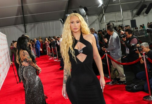 Iggy Azalea performs during 2024 Adult Video News Awards at Resorts World Las Vegas in Las Vegas - 27.01.2024

Iggy Azalea stuns in sleek black frock as she attends Adult Video News Awards in Las Vegas after quitting music career

Iggy Azalea cut a relatively modest figure as she attended a racy awards ceremony on Saturday night.

The Australian rapper, 33, stepped out for the 2024 Adult Video News Awards in Las Vegas, Nevada in a sleek black frock.

The dress featured peekaboo cutouts that flaunted a hint of bust and clung close to the performer's famous curves.

Iggy added a pair of nude high heels which matched her lip gloss and kept her accessories to a bracelet and a number of rings.

The blonde wore her long hair down in soft curls an opted for a clean makeup look with a peachy blush.

Iggy had earlier announced that she would be performing at the X-rated awards ceremony that celebrates the top performers in the porn industry.

'I'm thrilled to be performing at the AVN Awards—a celebration of passion, fearlessness, and artistic expression,' Iggy said in a statement.

'I can't wait to deliver a show that embodies the spirit of liberation and creative freedom. Let's make this an unforgettable night!'

It comes after Iggy quit the music industry, ten years after she shot to global fame with her song Fancy.

Iggy shared the shock announcement via X (formerly Twitter) earlier this month, penning a lengthy message to her fans about her plans to focus on other creative endeavours.

She also confirmed in her post she would no longer be finishing her upcoming fourth album.

'I know a lot of people have this idea that I was "bullied away from music" and that's something I've always laughed at because I'd never be bullied out of anything! In fact, I'm too stubborn,' Iggy began.

'I think I've even resisted changes within myself at times, purely because I don't like being viewed as someone who quits.'

Iggy, who recently announced she had come out of 'retirement' to pen a fourth album, said she now feels 'more passionately about design and creative direction' than she does about writing music.

'To many of you that's no shock to read. It shows in my work. Haha! Jokes aside, I do spend a lot more time on that part of things… because I'm most confident at that.'

'That's why I want to let you know that I'm not going to finish my album,' she continued.

Iggy said the album had been stalled in recent months while she was 'giving direction for a different project', and that she hasn't felt the 'urge' to get back to writing.

'I feel really happy and passionate in my day to day life when my mind's focused on that and so I want to stick to what's undeniably best for me,' she said.

The Mo Bounce hitmaker concluded by apologising to her fans, writing: 'I know for some fans this probably makes you feel a little deflated - I'm sorry to let you down.'

DailyMail

#IggyAzalea