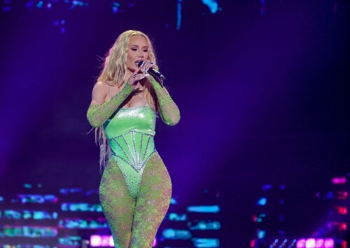 Iggy Azalea performs during 2024 Adult Video News Awards at Resorts World Las Vegas in Las Vegas - 27.01.2024

Iggy Azalea stuns in sleek black frock as she attends Adult Video News Awards in Las Vegas after quitting music career

Iggy Azalea cut a relatively modest figure as she attended a racy awards ceremony on Saturday night.

The Australian rapper, 33, stepped out for the 2024 Adult Video News Awards in Las Vegas, Nevada in a sleek black frock.

The dress featured peekaboo cutouts that flaunted a hint of bust and clung close to the performer's famous curves.

Iggy added a pair of nude high heels which matched her lip gloss and kept her accessories to a bracelet and a number of rings.

The blonde wore her long hair down in soft curls an opted for a clean makeup look with a peachy blush.

Iggy had earlier announced that she would be performing at the X-rated awards ceremony that celebrates the top performers in the porn industry.

'I'm thrilled to be performing at the AVN Awards—a celebration of passion, fearlessness, and artistic expression,' Iggy said in a statement.

'I can't wait to deliver a show that embodies the spirit of liberation and creative freedom. Let's make this an unforgettable night!'

It comes after Iggy quit the music industry, ten years after she shot to global fame with her song Fancy.

Iggy shared the shock announcement via X (formerly Twitter) earlier this month, penning a lengthy message to her fans about her plans to focus on other creative endeavours.

She also confirmed in her post she would no longer be finishing her upcoming fourth album.

'I know a lot of people have this idea that I was "bullied away from music" and that's something I've always laughed at because I'd never be bullied out of anything! In fact, I'm too stubborn,' Iggy began.

'I think I've even resisted changes within myself at times, purely because I don't like being viewed as someone who quits.'

Iggy, who recently announced she had come out of 'retirement' to pen a fourth album, said she now feels 'more passionately about design and creative direction' than she does about writing music.

'To many of you that's no shock to read. It shows in my work. Haha! Jokes aside, I do spend a lot more time on that part of things… because I'm most confident at that.'

'That's why I want to let you know that I'm not going to finish my album,' she continued.

Iggy said the album had been stalled in recent months while she was 'giving direction for a different project', and that she hasn't felt the 'urge' to get back to writing.

'I feel really happy and passionate in my day to day life when my mind's focused on that and so I want to stick to what's undeniably best for me,' she said.

The Mo Bounce hitmaker concluded by apologising to her fans, writing: 'I know for some fans this probably makes you feel a little deflated - I'm sorry to let you down.'

DailyMail

#IggyAzalea