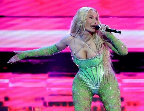 Iggy Azalea performs during 2024 Adult Video News Awards at Resorts World Las Vegas in Las Vegas - 27.01.2024

Iggy Azalea stuns in sleek black frock as she attends Adult Video News Awards in Las Vegas after quitting music career

Iggy Azalea cut a relatively modest figure as she attended a racy awards ceremony on Saturday night.

The Australian rapper, 33, stepped out for the 2024 Adult Video News Awards in Las Vegas, Nevada in a sleek black frock.

The dress featured peekaboo cutouts that flaunted a hint of bust and clung close to the performer's famous curves.

Iggy added a pair of nude high heels which matched her lip gloss and kept her accessories to a bracelet and a number of rings.

The blonde wore her long hair down in soft curls an opted for a clean makeup look with a peachy blush.

Iggy had earlier announced that she would be performing at the X-rated awards ceremony that celebrates the top performers in the porn industry.

'I'm thrilled to be performing at the AVN Awards—a celebration of passion, fearlessness, and artistic expression,' Iggy said in a statement.

'I can't wait to deliver a show that embodies the spirit of liberation and creative freedom. Let's make this an unforgettable night!'

It comes after Iggy quit the music industry, ten years after she shot to global fame with her song Fancy.

Iggy shared the shock announcement via X (formerly Twitter) earlier this month, penning a lengthy message to her fans about her plans to focus on other creative endeavours.

She also confirmed in her post she would no longer be finishing her upcoming fourth album.

'I know a lot of people have this idea that I was "bullied away from music" and that's something I've always laughed at because I'd never be bullied out of anything! In fact, I'm too stubborn,' Iggy began.

'I think I've even resisted changes within myself at times, purely because I don't like being viewed as someone who quits.'

Iggy, who recently announced she had come out of 'retirement' to pen a fourth album, said she now feels 'more passionately about design and creative direction' than she does about writing music.

'To many of you that's no shock to read. It shows in my work. Haha! Jokes aside, I do spend a lot more time on that part of things… because I'm most confident at that.'

'That's why I want to let you know that I'm not going to finish my album,' she continued.

Iggy said the album had been stalled in recent months while she was 'giving direction for a different project', and that she hasn't felt the 'urge' to get back to writing.

'I feel really happy and passionate in my day to day life when my mind's focused on that and so I want to stick to what's undeniably best for me,' she said.

The Mo Bounce hitmaker concluded by apologising to her fans, writing: 'I know for some fans this probably makes you feel a little deflated - I'm sorry to let you down.'

DailyMail

#IggyAzalea