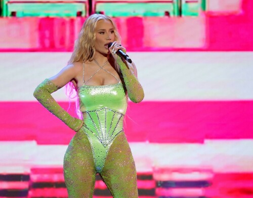 Iggy Azalea performs during 2024 Adult Video News Awards at Resorts World Las Vegas in Las Vegas - 27.01.2024

Iggy Azalea stuns in sleek black frock as she attends Adult Video News Awards in Las Vegas after quitting music career

Iggy Azalea cut a relatively modest figure as she attended a racy awards ceremony on Saturday night. 

The Australian rapper, 33, stepped out for the 2024 Adult Video News Awards in Las Vegas, Nevada in a sleek black frock. 

The dress featured peekaboo cutouts that flaunted a hint of bust and clung close to the performer's famous curves.

Iggy added a pair of nude high heels which matched her lip gloss and kept her accessories to a bracelet and a number of rings. 

The blonde wore her long hair down in soft curls an opted for a clean makeup look with a peachy blush.

Iggy had earlier announced that she would be performing at the X-rated awards ceremony that celebrates the top performers in the porn industry.

'I'm thrilled to be performing at the AVN Awards—a celebration of passion, fearlessness, and artistic expression,' Iggy said in a statement.

'I can't wait to deliver a show that embodies the spirit of liberation and creative freedom. Let's make this an unforgettable night!'

It comes after Iggy quit the music industry, ten years after she shot to global fame with her song Fancy.

Iggy shared the shock announcement via X (formerly Twitter) earlier this month, penning a lengthy message to her fans about her plans to focus on other creative endeavours. 

She also confirmed in her post she would no longer be finishing her upcoming fourth album.  

'I know a lot of people have this idea that I was "bullied away from music" and that's something I've always laughed at because I'd never be bullied out of anything! In fact, I'm too stubborn,' Iggy began. 

'I think I've even resisted changes within myself at times, purely because I don't like being viewed as someone who quits.'

Iggy, who recently announced she had come out of 'retirement' to pen a fourth album, said she now feels 'more passionately about design and creative direction' than she does about writing music.

'To many of you that's no shock to read. It shows in my work. Haha! Jokes aside, I do spend a lot more time on that part of things… because I'm most confident at that.'

'That's why I want to let you know that I'm not going to finish my album,' she continued. 

Iggy said the album had been stalled in recent months while she was 'giving direction for a different project', and that she hasn't felt the 'urge' to get back to writing.  

'I feel really happy and passionate in my day to day life when my mind's focused on that and so I want to stick to what's undeniably best for me,' she said.

The Mo Bounce hitmaker concluded by apologising to her fans, writing: 'I know for some fans this probably makes you feel a little deflated - I'm sorry to let you down.'

DailyMail

#IggyAzalea