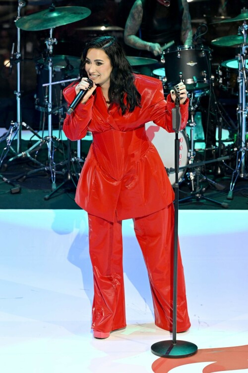 Demi Lovato | The American Heart Association's Red Dress Collection Concert in New York - 31.01.2024

Demi Lovato is ravishing in red for American Heart Association Red Dress Collection concert

The singer wore two stylish red looks that were hard to miss.

Demi Lovato was spotted Wednesday rocking not one, but two striking red looks that were hard to miss.

The singer attended the American Heart Association's Go Red for Women Dress Collection Concert in New York City, walking the red carpet in a billowing red ballgown custom-created by Nicole + Felicia Couture.

She paired the look with a small clutch purse and dark, short nails. Her hair was styled with a side part and soft shoulder-length waves.

Music and fashion are brought together during the annual event, all in the name of raising awareness about cardiovascular disease.

Lovato also performed during the concert, taking the stage wearing an ensemble different from what she wore on the red carpet: a shiny red pantsuit that included a boned corset over her jacket.

"Tonight is all about how reminding women how important it is to advocate for ourselves and prioritize our health," Lovato wrote in a caption posted on her Instagram stories. "Join me and @american_heart and @goredforwomen as we Go Red for Women!"

In addition to Lovato, other attendees at the American Heart Association's Go Red for Women Dress Collection Concert included Mira Sorvino, Sherri Shepherd, Samira Wiley, Mickey Guyton, and a host of others, all of whom wore their own unique red ensembles.

abcnews

#DemiLovato