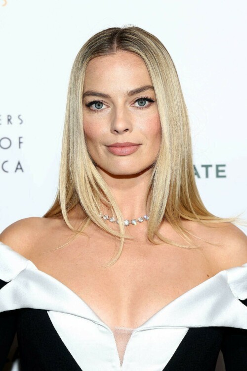 Margot Robbie | Producers Guild Awards in Hollywood - 25.02.2024

Margot Robbie leads glam arrivals in black minidress at the Producers Guild Awards

The event celebrated the crème de la crème of the film and television production industry

The 35th Annual Producers Guild Awards in Los Angeles was a star-studded affair, drawing an illustrious array of talent to its red carpet on Sunday.

The event celebrated the crème de la crème of the film and television production industry, with nominees eagerly awaiting to see if their work would be honored.

Among the glamorous attendees was Margot Robbie, 33, who radiated elegance in a chic black and white mini dress that showcased her sculpted legs.

The Barbie star's ensemble was perfectly complemented by a sparkling diamond necklace, adding a touch of glamour to her look. By her side was her equally stylish husband, Tom Ackerley, 33, who opted for a classic navy suit.

With the ceremony held at The Day Dolby Ballroom at Hollywood and Highland on February 25, the event was a testament to the guild's role in honoring excellence in production across film, television, and more.

Special honors this year included Tom Cruise receiving the David O. Selznick Achievement Award in Theatrical Motion Pictures, and Mindy Kaling being awarded the Norman Lear Achievement Award in Television.

hellomagazine

#MargotRobbie