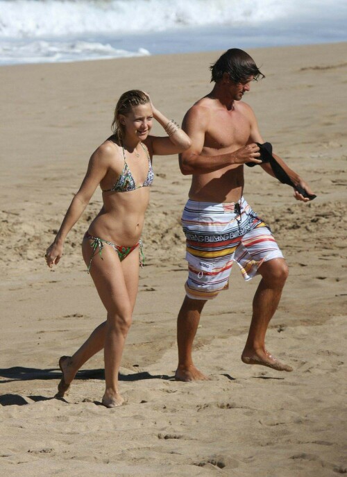 Romance heats up for Kate Hudson and Australian golfer Adam Scott in Hawaii - 12.01.2009After a string of failed relationships, it seems Hollywood star Kate Hudson has bounced back with a hot new romance.

The Bride Wars star was spotted frolicking on the beach with Australian PGA star Adam Scott in Hawaii yesterday.

Dressed in a tiny string bikini, Kate - who famously dated Owen Wilson and Lance Armstrong - spent the morning flirting up a storm with the 28-year-old while topping up her tan.

The pair first sparked whispers of a romance after they were spotted dining with a group friends at the Kapalua Resort last week.

However, Scott played down the rumours after the final round at the Mercedes-Benz Championship over the weekend.

He told reporters: 'I'm not here with her but I know Kate. We met here [for the first time]. We have a mutual friend so we met through him.'

The golfer is considered to be one of Australia's most eligible bachelors after splitting from long-term Swedish girlfriend Marie Kojzar last year.

Kate, 29, who has been described as a 'a hot ticket' on the dating scene by her close friend Stella McCartney, previously insisted she was steering clear of relationships.

'I'm actually enjoying being single right now because I really never have been,' she told InStyle magazine's January issue.

'I feel good in relationships. I enjoy them, so I feel my best when I'm in something solid. But it's also the first time I've ever taken a step back and gotten a new perspective.'

She said at the time: 'I've made a conscious decision to try to stay single as long as possible.'

Before jetting off to Hawaii, Kate was linked with New York Yankees baseball star Alex Rodriguez, who grew close to Madonna after her split from Guy Ritchie.

However, her spokesperson shot down reports the pair were dating.

Kate, the daughter of Goldie Hawn, has a five-year-old son Ryder with ex-husband Chris Robinson.

DailyMail

#KateHudson