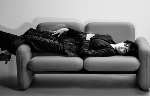 Anne Hathaway | Photoshooting for V-Magazine - 2024

V148: ANNE HATHAWAY IS ENTERING MOTHER STATUS

Ahead of the premiere of The Idea of You’, actor and all around sweetheart Anne Hathaway caught up with her college friend Derek Blasberg to chat about their fashion obsessions, the fact that Hathaway once did a chemistry test that required her to kiss 10 guys, and the possibility of ‘Princess Diaries 3’

Photography Chris Colls / Fashion Gro Curtis / Text by Derek Blasberg

Anne Hathaway is standing in my kitchen perusing my selection of herbal teas. This wasn’t the plan. We spent several days debating if we should meet for this interview at a fancy uptown sushi restaurant, a cheap diner, or the lobby of an elegant hotel. But, when today rolled around, she said she’d rather come over, play with my kids, and chat in the comfort of my kitchen. Hathaway has a habit of landing on the path of least resistance, which I’ve long admired. Keep it calma, one might say. And honestly, why pay $85 for a California roll when you can play peekaboo with two of the cutest kids in New York City?

We met in the early 2000s. I was an NYU student and she was fresh off her star-making turn as Mia Thermopolis in 2001’s The Princess Diaries, a role scored when the Brooklyn-born, New Jersey-raised fledgling actress was 17 years old. Our fateful first meeting on a chilly afternoon in the winter of 2002, walking into brunch with mutual friends outside the Mercer Hotel, will be engraved in my brain forever. “Call me Annie,” she chirped, pushing her long, thick brunette locks off her bright, porcelain skin and showing off a brilliant megawatt smile.

Now, at 41, Annie has been in more than 50 films ranging from low-budget indies to major motion pictures. She’s been nominated for every performance award in existence, won an Oscar (for 2012’s Les Miserables), and even hosted the Oscars in 2011 (“badly,” she adds). At 29, she married Adam Shulman (the bride wore a dress by her dear friend Valentino, of course), and they have two sons. And, she looks divine. The current face of Versace, Bulgari, and Shiseido, she has become a beloved fashion figure who’s as familiar in the front rows of New York and Milan fashion weeks as a certain well-known Devil-ish fashion editrix.

When we settle in at the kitchen table and flip on the recorder, Annie observes how much has changed in the last two decades. Gone are our days as eager teens brunching at downtown hotspots. They’re replaced by two parents cuddled in uptown apartments wondering if it’s too late to drink tea with caffeine. (After much debate, we decided on a pot of caffeine-free Korean moonwalk tea.) But, one topic that we’ll never get bored of: Fashion.

Like the rest of the style world, Annie was mesmerized by John Galliano’s epic, sweeping, haunting couture collection for Maison Margiela, which debuted in January in Paris, and is what she wears on one of the covers of this very issue of V. “I thought it was extraordinary. I got really into the leather work, the way it created a porcelain effect, the craft of it. The production value of the show, the way they combined dancers and models, the movement, it was so beautiful—the broken umbrella!” she says. When conceptualizing the shoot with Stephen Gan, V’s founder, and the creative director, “I mentioned how much I love menswear and how I am drawn to the visual language of masculine/feminine. And the shoot sort of grew out from there.”

We could talk about fashion for hours–“the makeup is snatched,” the shoot was “fashion but make it fashion”–so it’s a little surprising when Annie reveals she doesn’t truly identify as a fashion person. “I really don’t,” she insists. “I view myself more as a guest.” Conjuring Emily Blunt in The Devil Wears Prada, I sip tea dramatically while giving her a quizzical look. “I think it’d be an insult to someone whose education revolved around it, whose life revolves around it, who has done a full fashion cycle in multiple cities as opposed to just, like, getting invited to a show and an after-party. I think there’s a degree of stamina and schlepping involved in being a proper fashion person. I’m very grateful to be a guest. I mean, I’ve studied it, but it’s informal. I’m aware of the history. I love fashion photography. And I’ve been welcomed for a long time and been shown great kindness and generosity by people whose lives it is. But I’m an actress first.”

Oh yeah, her day job. This May, she’s starring in The Idea of You as Solène Marchand, a movie that has been described as the story of a single mother falling in love with Harry Styles at Coachella, except it’s not Harry and they didn’t shoot at Coachella. “Notchella!” she smiles. (The majority of the film was made in Georgia, which was a double for California and every other stop on a European stadium tour.) When her character brings her daughter to the Coachella Music Festival, she accidentally meets Hayes Campbell of the boy band phenom August Moon and embarks on an unexpected love affair. “It is this story about a single mother fully embracing her sexuality at a time in her life and a woman’s life where, traditionally, we begin to be erased.”

Hayes is played by 29-year-old Nicholas Galitzine, who starred in 2023’s Red, White, and Royal Blue and Bottoms, and will also appear opposite Julianne Moore in this year’s Mary & George. He may not have been in One Direction but he definitely has the charisma of a boy wonder. “We had met a number of young men already, but I remember laughing when Nick walked in because he was so ridiculously perfect for the part. I just thought, he is it,” she says. But, she still asked all the right questions. “Is he gonna be able to read the lines? Read the lines, great. Okay, can you sing? Oh, my God, he can sing. Wait and he can play the guitar? Okay, and he’s just fun to be around. He’s just charming. Like, he’s just charmed this entire room.”

It’s important to note Hathaway is a producer on this film. That comes in handy when advocating for herself in film projects and developing new ways to go about things, like chemistry tests. “Back in the 2000s—and this did happen to me—it was considered normal to ask an actor to make out with other actors to test for chemistry. Which is actually the worst way to do it,” she says. “I was told, ‘We have ten guys coming today and you’re cast. Aren’t you excited to make out with all of them?’ And I thought, ‘Is there something wrong with me?’ because I wasn’t excited. I thought it sounded gross. And I was so young and terribly aware how easy it was to lose everything by being labeled ‘difficult,’ so I just pretended I was excited and got on with it. It wasn’t a power play, no one was trying to be awful or hurt me. It was just a very different time and now we know better.”

As a producer who’s been a working actor for more than half of her life, Hathaway knew that finding a spark didn’t require her to make out with a bunch of twenty-somethings. So, how did they go about getting the right guy? “We asked each of the actors coming in to choose a song that they felt their character would love, that they would put on to get my character to dance, and then we’d do a short little improv. I was sitting in a chair like we had come in from dinner or a walk or something, we pressed play, and we just started dancing together.”

What band did Nick pick? “The Alabama Shakes. And it was just easy. I heard [the lead singer of Alabama Shake’s] Brittany’s voice and I just started smiling. And he saw me smile, so he relaxed, and we just started dancing. Nobody was showing off. Nobody was trying to get the gig. We were just in a space dancing. I looked over and Michael Showalter, our director, was beaming. Spark!”

he actor-turned-producer path has been well-trotted. We see that with some of Hathaway’s contemporaries; Reese Witherspoon, whose production company produced Oscar-winning hits like Wild and Gone Girl, and hit TV shows like Big Little Lies and The Morning Show, immediately comes to mind. But these are the 21st-century versions of women like silent film star Mary Pickford, who co-founded United Artists in 1919, at the age of 27, and Lucille Ball, the I Love Lucy star who became the first female head of a major studio when she bought out ex-husband Desi Arnaz from their Desilu Productions in 1962. To be an actor who is also in the position of producer, it must be validating to find a way other than making out with ten guys to find a costar.

“To be honest, it never occurred to me that I didn’t have the power of a point of view, at least creatively as it related to my character. I’m really lucky. My first substantial film role, the second film I ever did, was The Princess Diaries. I was so generously invited into that process by Garry Marshall; he valued my take on being a teenage girl and elevated me to such a valued status on set that it never occurred to me on other sets that I didn’t have that same autonomy, or that same ability to collaborate. I always wanted to be pleasant. But I also always thought that having strong opinions meant I was doing my job.”

In January, Annie literally put on a producer’s hat. In the last scene of ‘Gutenberg,’ a two-person Broadway musical starring Josh Gad and Andrew Rannells, the play ends (spoiler alert, kinda?) with someone from the audience being pulled up to the stage to play the part of surprise producer to judge the performance. Hillary Clinton, Patti LuPone, Martin Short, and Steve Martin have all played the big reveal, and this night it was Anna Wintour and Annie. (Annie played Anna’s assistant, of course.) Annie looked good on a Broadway stage and I wonder how she felt up there. “Am I gross if I say ‘home’?” Honesty is the best policy. “Yeah, I really want that, there’s no hiding it,” she says. “[Being on Broadway] was my first dream, you know? And so many amazing, extraordinary things have happened to me but not that one yet. It’s a goal that is very, very much alive inside of me.”

While we’re fantasizing future projects, let’s discuss the prospects of sequels to some of her biggest hits. What’s the likelihood of a third installment of The Princess Diaries series? “We’re in a good place,” she says. Is that all you can say? “That’s all I can say. There’s nothing to announce yet. But we’re in a good place.” What about the Devil Wears Prada 2? “Probably not. We all love each other and if somebody could come up with a way to do it, I think we’d all be crazy not to. But there’s a huge difference in the world now with technology, and one of the things about that particular story is it was about producing a physical object. Now with so much being digital, it would just be very different. Maybe me, Stanley, Emily, Meryl, Dave Frankel, Patricia Field…we should just all do something else together. That’d be fun.”

Another reason it may be hard to cast Annie in the role of a fashion assistant is that she is so clearly in another phase of her career. One reason she was drawn to the role of Solène in The Idea of You is because it’s so close to where she is in her life. “She’s not this boldly colorful, fabulous, attention-grabbing person,” she says, adding that she can tell when she finds a character that matches a part of life that she’s living. “She’s actually just sweet and smart and lovely with a surprisingly sharp sense of humor and I genuinely would love to be friends with her. She’s cozy.” But is that an interesting character to play?

“She’s going through a moment in her life when she is on the verge of becoming bitter. She experienced a trust trauma. And a trust trauma is a hard thing to come back from; all that sweetness is beginning to sour. That’s not a role I could have played on day one of my career. Also, I don’t know how else to say it but I just thought it was a fun premise. One of the points that the movie makes is something that really resonates with me: We have limited ideas of appropriate ways for women to be happy. And we react harshly and punitively when we feel that women have stepped outside those boundaries. I think that needs to stop, so I made a movie about it.” It sounds like she may know something about proving people wrong.

“I loved getting to play a character who has to come up against what the world thinks about her, how they’ve judged her, and decides to choose her own happiness. There’s this line where her ex-husband who left her, who is clearly threatened by her new choices, tries to shame her by saying: ‘Do you even know what people are saying about you?’ And you know what her response is?” Give it to me. “‘No.’ Period. I just loved that.”

vmagazine.com

#AnneHathaway