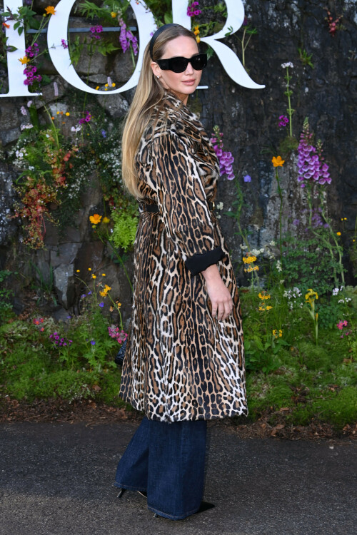 Jennifer Lawrence | Christian Dior Cruise show, Drummond Castle, Crieff, Scotland, UK - 03.06.2024

9 HQ pics: http://kosty555.info/index.php?showtopic=307683

Jennifer Lawrence proves the enduring power of the leopard-print coat in Scotland

An unconventional staple for spring

Jennifer Lawrence brought out her wild side to sit front row at Dior’s Cruise 2025 catwalk show last night, held at Drummond Castle in Perthshire, Scotland.

The actress exuded rich-mom energy in a lavish fur coat in brown, black, and white leopard print. She rolled the outerwear up at the sleeves, revealing the black inside layer, and cinched it at the waist with a black leather belt featuring a golden Christian Dior logo buckle.

Lawrence wore the statement coat over a simple white ribbed Dior tank — emblazoned with the house logo and a little bumblebee at the centre — and deep blue wide-leg jeans. She finished the outfit with black accessories: a chic headband that held down her straight caramel hair, large square shades, a small Lady D-Joy Bag, and pointed-toe pumps. For extra glamour, she added on her go-to diamond stud earrings and her diamond engagement ring from husband Cooke Maroney.

When it came to glam, the No Hard Feelings star and Dior ambassador wore a bronze smoky eye and a glossy cotton-candy pink lip from Dior Beauty.

Lawrence tends to stay true to the French fashion house for grand occasions, and regularly supports the brand and its runway shows around the world.

In February, the actor perfected the Parisian-chic aesthetic in a smoky grey three-piece tweed suit by Dior, which she wore to the brand’s autumn/winter 2024 show in Paris.

And days later, at the Oscars, she walked the red carpet in a strapless black gown with white polka dots all over. The couture piece featured a corseted bodice, an full skirt, and a matching shawl, which the actor rested on her shoulders. Lawrence wore it with Manolo Blahnik pumps and gleaming diamond jewellery by Swarovski.

harpersbazaar.com

#JenniferLawrence
