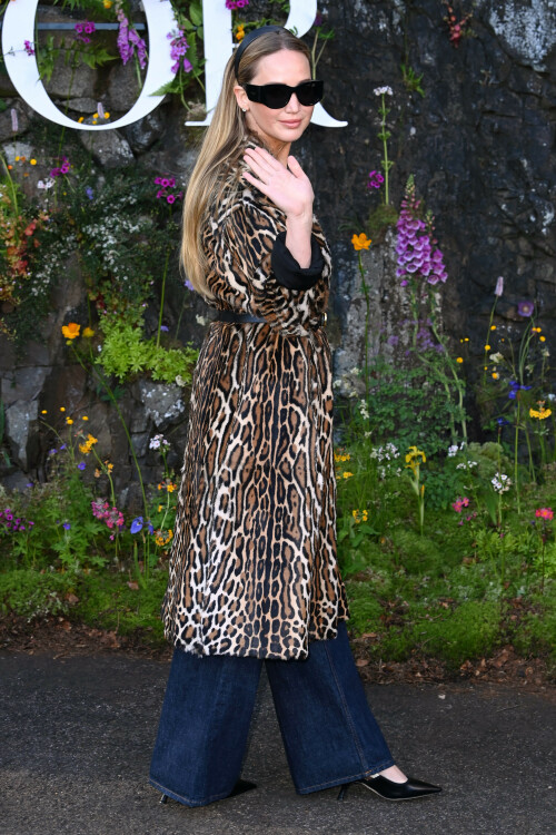 Jennifer Lawrence | Christian Dior Cruise show, Drummond Castle, Crieff, Scotland, UK - 03.06.2024

9 HQ pics: http://kosty555.info/index.php?showtopic=307683

Jennifer Lawrence proves the enduring power of the leopard-print coat in Scotland

An unconventional staple for spring

Jennifer Lawrence brought out her wild side to sit front row at Dior’s Cruise 2025 catwalk show last night, held at Drummond Castle in Perthshire, Scotland.

The actress exuded rich-mom energy in a lavish fur coat in brown, black, and white leopard print. She rolled the outerwear up at the sleeves, revealing the black inside layer, and cinched it at the waist with a black leather belt featuring a golden Christian Dior logo buckle.

Lawrence wore the statement coat over a simple white ribbed Dior tank — emblazoned with the house logo and a little bumblebee at the centre — and deep blue wide-leg jeans. She finished the outfit with black accessories: a chic headband that held down her straight caramel hair, large square shades, a small Lady D-Joy Bag, and pointed-toe pumps. For extra glamour, she added on her go-to diamond stud earrings and her diamond engagement ring from husband Cooke Maroney.

When it came to glam, the No Hard Feelings star and Dior ambassador wore a bronze smoky eye and a glossy cotton-candy pink lip from Dior Beauty.

Lawrence tends to stay true to the French fashion house for grand occasions, and regularly supports the brand and its runway shows around the world.

In February, the actor perfected the Parisian-chic aesthetic in a smoky grey three-piece tweed suit by Dior, which she wore to the brand’s autumn/winter 2024 show in Paris.

And days later, at the Oscars, she walked the red carpet in a strapless black gown with white polka dots all over. The couture piece featured a corseted bodice, an full skirt, and a matching shawl, which the actor rested on her shoulders. Lawrence wore it with Manolo Blahnik pumps and gleaming diamond jewellery by Swarovski.

harpersbazaar.com

#JenniferLawrence
